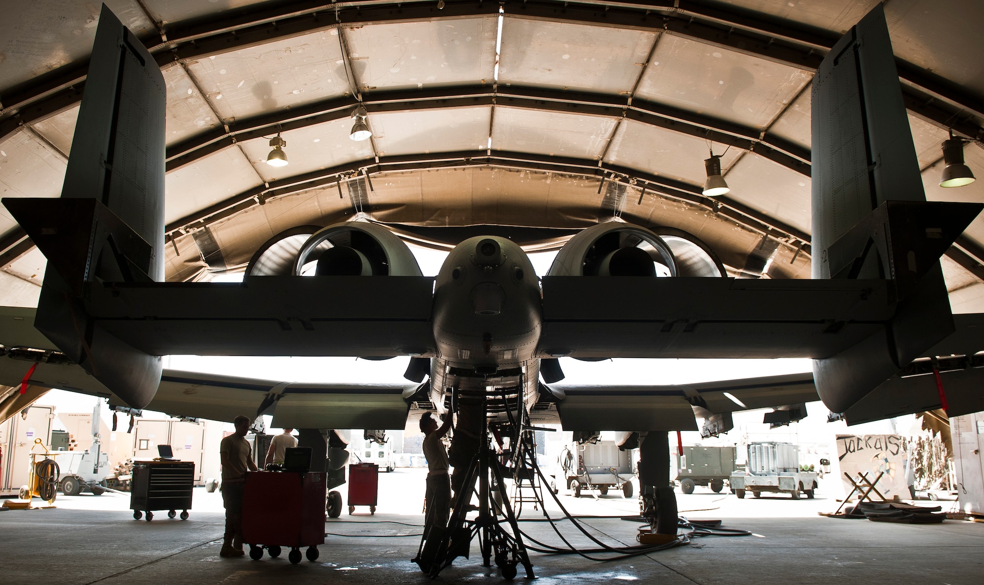 Maintainers with the 455th Expeditionary Maintenance Squadron work on a U.S. Air Force A-10 Thunderbolt II during phase maintenance at Bagram Airfield, Afghanistan, August 9, 2012. Deployed Aircraft endure increased flight hours and more combat maneuvers, which increases the need for routine maintenance and inspections. (U.S. Air Force Photo/Capt. Raymond Geoffroy)