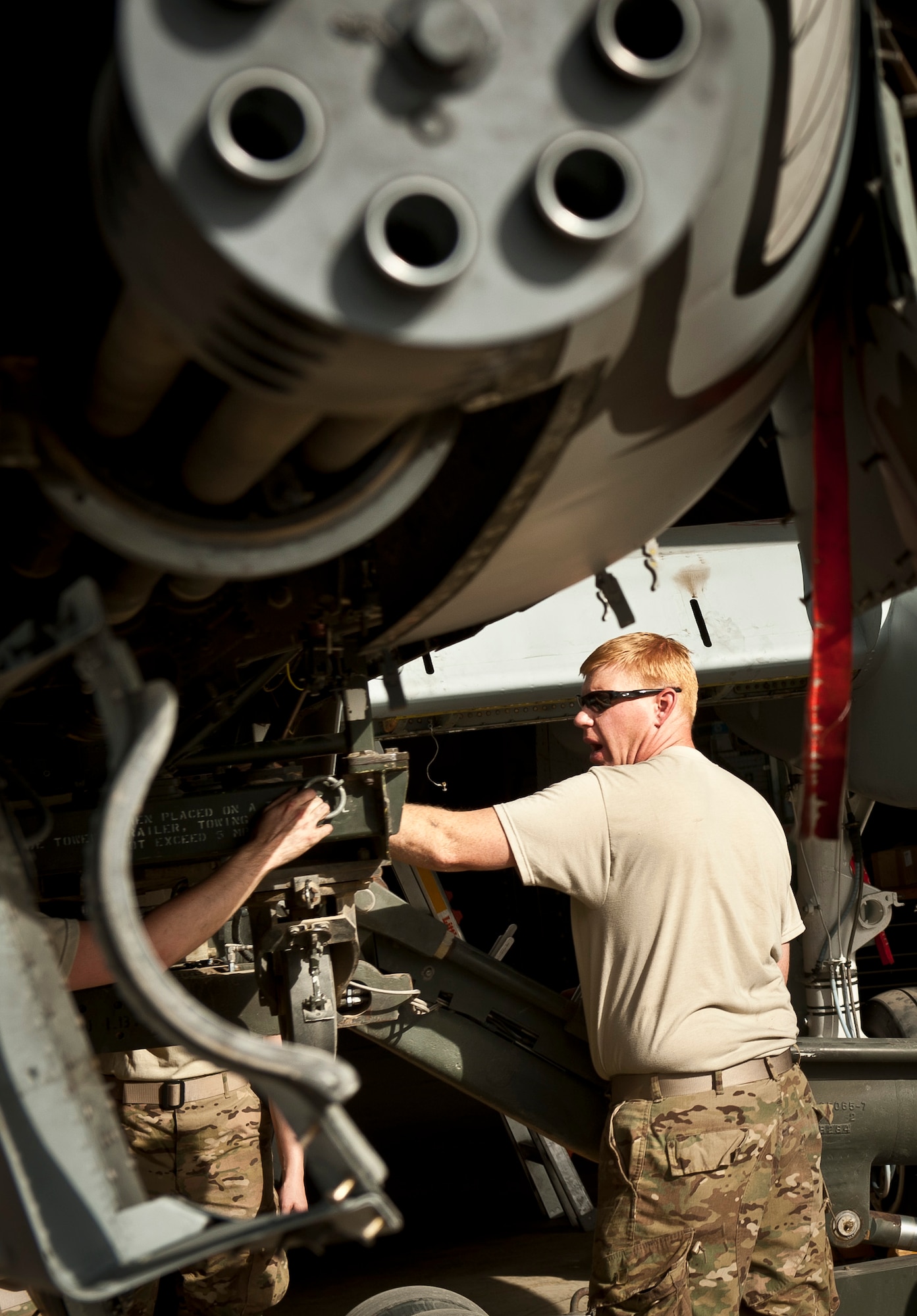 MSgt Daniel Boyd, an armament systems mechanic with the 455th Expeditionary Maintenance Squadron, oversees the removal of an ammo drum from a U.S. Air Force A-10 Thunderbolt II during phase maintenance at Bagram Airfield, Afghanistan, August 8, 2012. Phase maintenance is a comprehensive inspection and tune up performed on USAF aircraft at certain flight hour intervals. (U.S. Air Force Photo/Capt. Raymond Geoffroy)