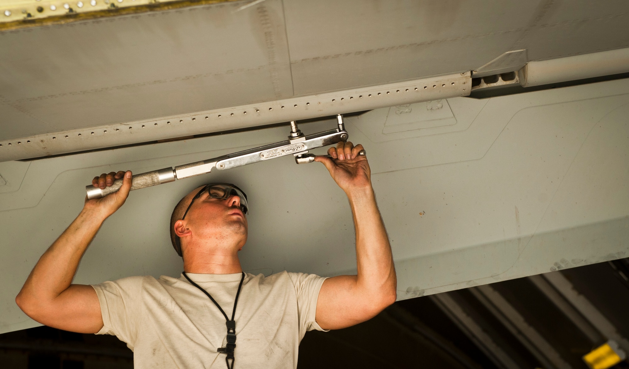 SrA William Fine, an aircraft phase maintenance specialist with the 455th Expeditionary Maintenance Squadron, works on the wing of a U.S. Air Force A-10 Thunderbolt II during phase maintenance at Bagram Airfield, Afghanistan, August 8, 2012. The Airmen adhere to a strict schedule of maintenance to keep Bagram’s aircraft safe and operational. (U.S. Air Force Photo/Capt. Raymond Geoffroy)