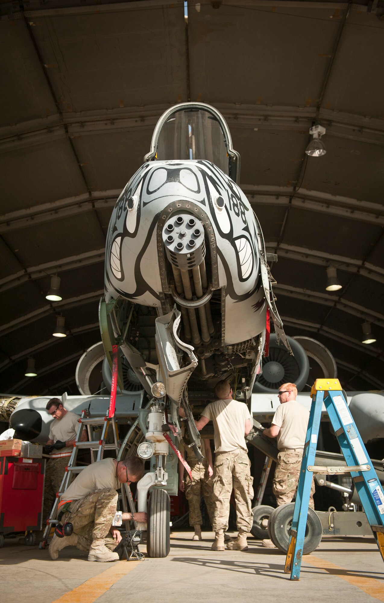 Maintainers with the 455th Expeditionary Maintenance Squadron work on a U.S. Air Force A-10 Thunderbolt II during phase maintenance at Bagram Airfield, Afghanistan, August 8, 2012. While deployed, USAF aircraft endure increased flight hours and more combat maneuvers, which increases the need for routine maintenance and inspections. (U.S. Air Force Photo/Capt. Raymond Geoffroy)