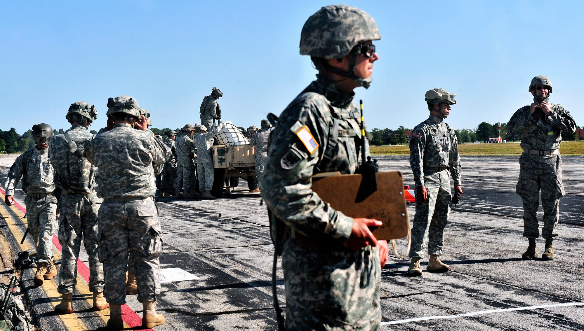 Members of the Illinois National Guard prepare to participate in sling load training on Scott Air Force Base, Ill. Aug. 11, 2012. The U.S. Transportation Command's Joint Transportation Reserve Unit, held this training for Air Force, Army, Navy and Department of Homeland Security personnel to learn about sling load and medical evacuation in the event of a natural disaster or emergency were to occur in this area. This is the first time the training has taken place on Scott. (U.S. Air Force photos/ Staff Sgt. Stephenie Wade)
