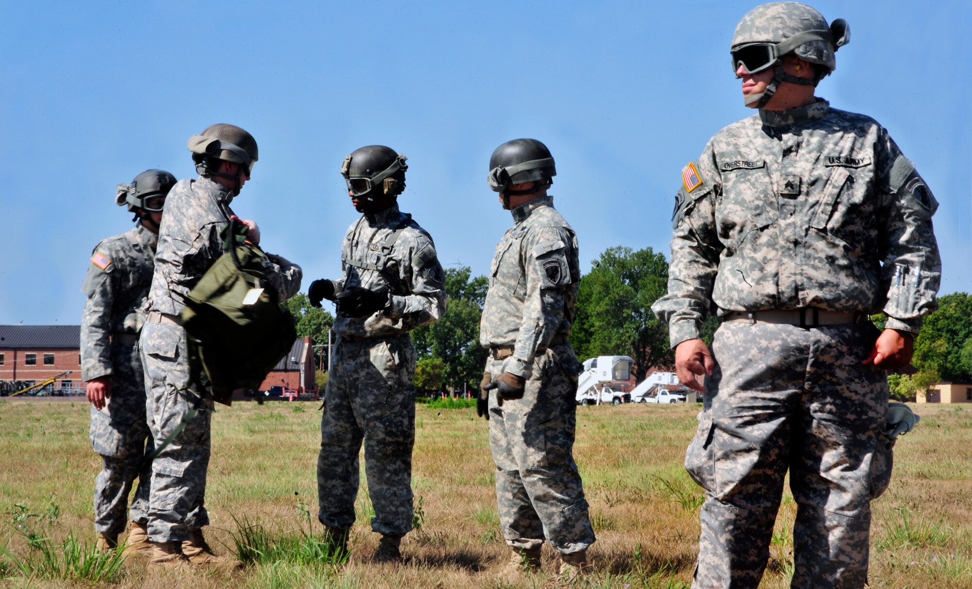 Members of the Illinois National Guard prepare to participate in sling load training on Scott Air Force Base, Ill. Aug. 11, 2012. The U.S. Transportation Command's Joint Transportation Reserve Unit, held this training for Air Force, Army, Navy and Department of Homeland Security personnel to learn about sling load and medical evacuation in the event of a natural disaster or emergency were to occur in this area. This is the first time the training has taken place on Scott. (U.S. Air Force photos/ Staff Sgt. Stephenie Wade)
