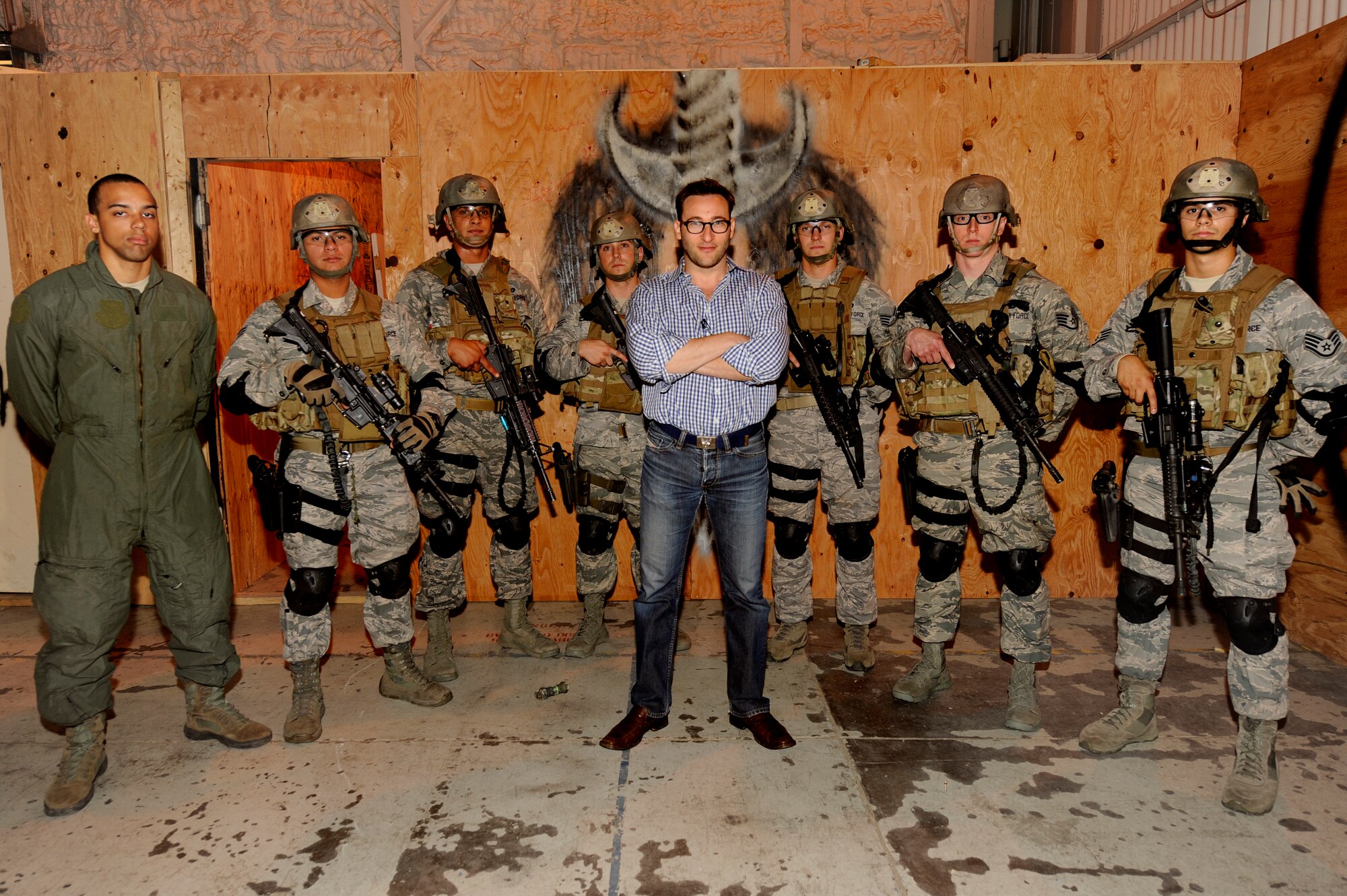 MINOT AIR FORCE BASE, N.D. -- Simon Sinek, author of the book "Start with why," poses with members of 91st Security Forces Group's tactical response force following a demonstration of breaching and capture techniques here Aug. 6. In addition to viewing the demonstration, Sinek also spoke to Airmen at various venues about teamwork and leadership skills. (U.S. Air Force photo/Airman 1st Class Stephanie Ashley)