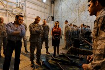 MINOT AIR FORCE BASE, N.D. -- Simon Sinek, author of the book "Start with why," is shown an assortment of weapons and gear utilized by members of the 91st Security Forces Group's tactical response force here Aug. 6. Sinek spoke to members on base about leadership and teamwork before touring various facilities on base and learning about the day to day life of Team Minot Airmen. (U.S. Air Force photo/Airman 1st Class Stephanie Ashley)