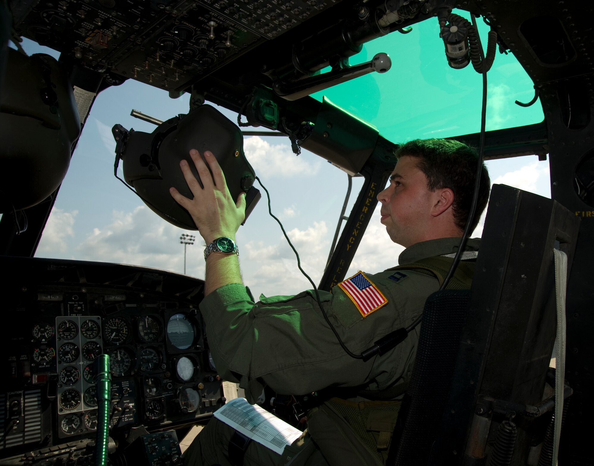 U.S. Air Force Capt. David Lee, a combat aviation adviser of 6th Special Operations Squadron, sits in the cockpit of a UH-1N Huey on the flight line on Hurlburt Field, Fla., Aug. 13, 2012.  Squadron advisers possess specialized capabilities for foreign internal defense, unconventional warfare and coalition support.  (U.S. Air Force Photo/Airman 1st Class Naomi M. Griego)