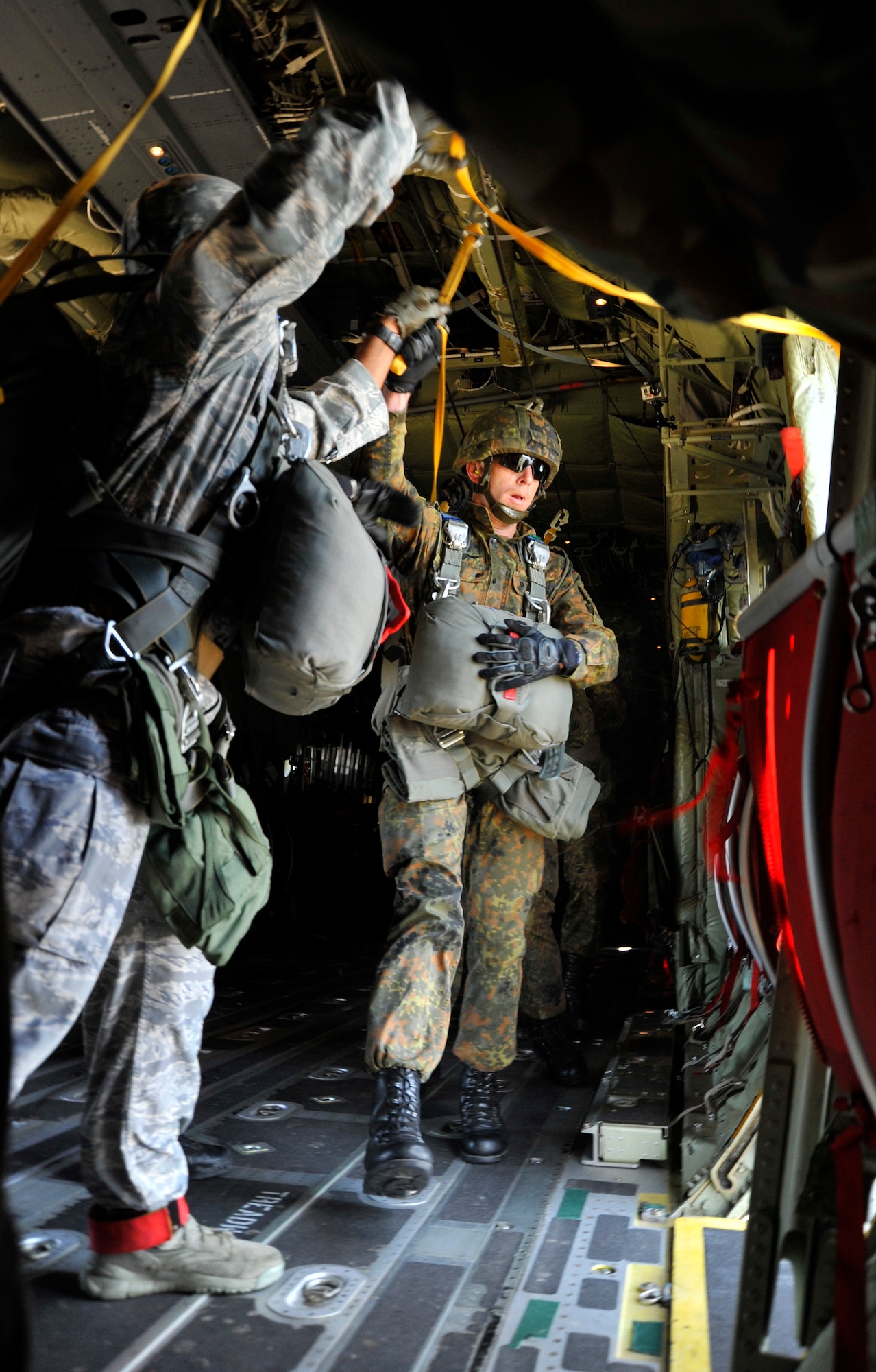A German Paratrooper prepares to jump out of a C-130J Super Hercules during International Jump Week 2012, Aug. 15, near Alzey, Germany. Members of six NATO countries came together to trade jump tactics and techniques and got the opportunity to earn the other nation’s jump wings. (U.S. Air Force photo/Airman 1st Class Trevor Rhynes)