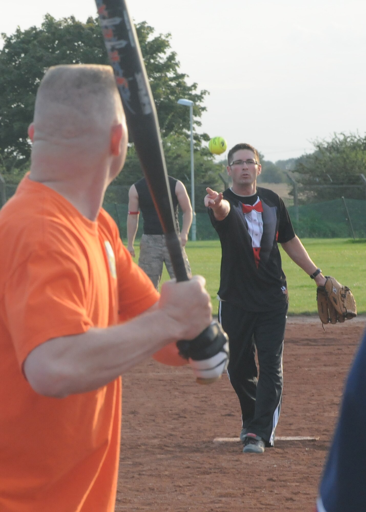 RAF MILDENHALL, England – Bradley Newman, 100th Security Forces Squadron, pitches to James Mork, 100th Logistics Readiness Squadron, during the Team Mildenhall intramural softball championship Aug. 14, 2012. The 100th LRS defeated the 100th SFS 8 – 4 to claim the championship trophy. (U.S. Air Force photo by Tech. Neal X. Joiner)
