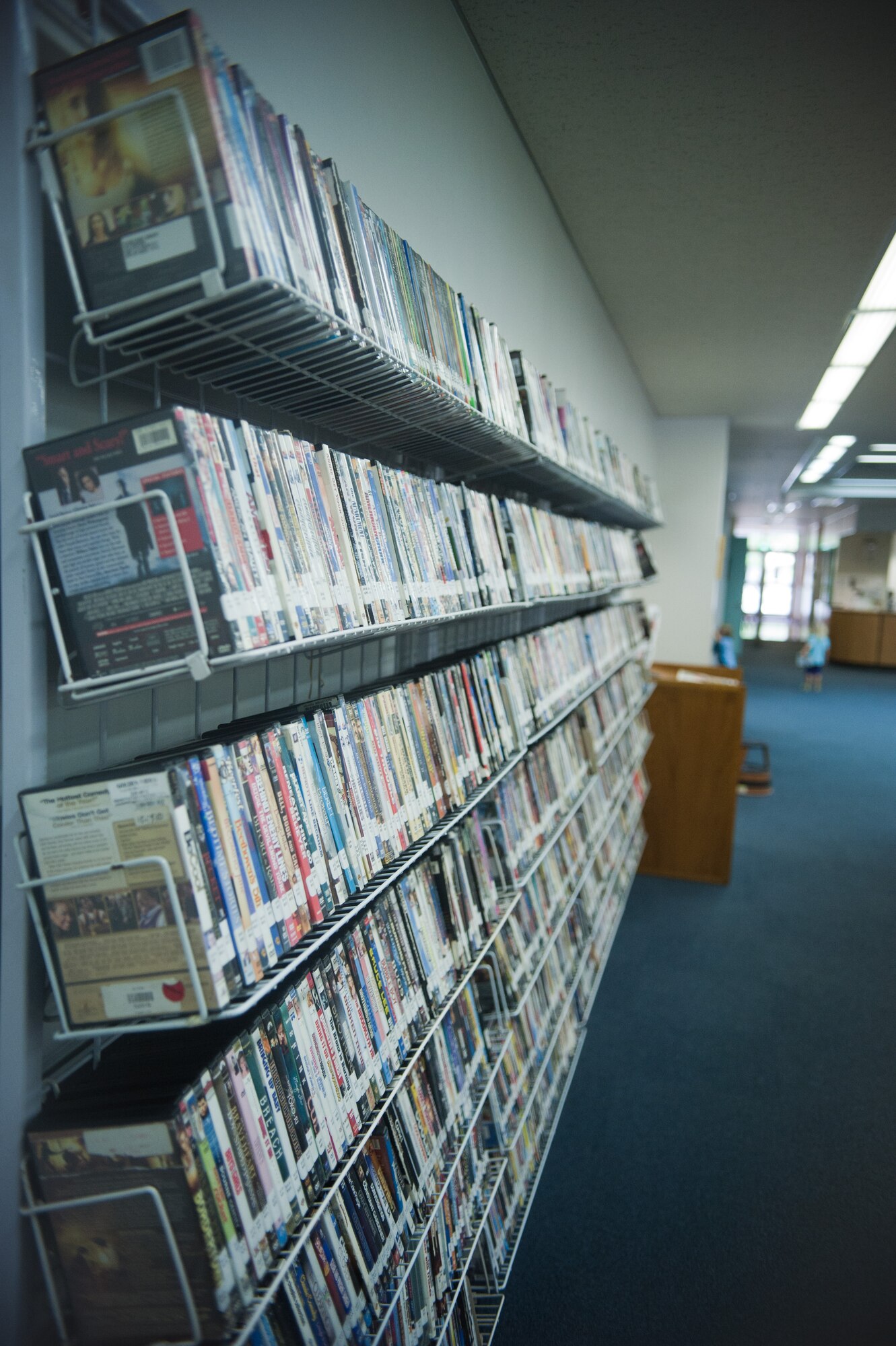 YOKOTA AIR BASE, Japan -- A shelf displays DVDs located at the Base Library at Yokota Air Base, Japan, on Aug. 14, 2012. The library houses more than 4,500 movies and several popular TV series, all of which can be checked-out for up to one week. (U.S. Air Force photo by Airman 1st Class John D. Partlow)