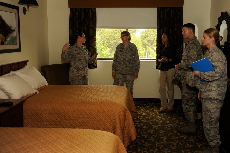 Tech. Sgt. Jessica Harrod, 8th Force Support Squadron guest services manager, gives Brig. Gen. Eden Murrie, Air Force Services director, a tour of base lodging to show how it impacts the Airmen at Kunsan Air Base, Republic of Korea, Aug. 14, 2012. The base lodging has 8 business suites and 192 single occupancy rooms with its own coffee shop and fitness room. (U.S. Air Force photo/Senior Airman Marcus Morris)