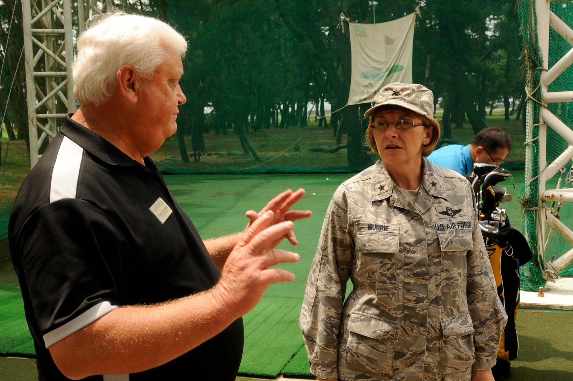 James Under, 8th Force Support Squadron golf course manager, shows Brig. Gen. Eden Murrie, Air Force Services director, what the golf course offers at Kunsan Air Base, Republic of Korea, Aug. 14, 2012. Murrie visited many Force Support establishments to see what needed improvements and how effectively they are operating . (U.S. Air Force photo/Senior Airman Marcus Morris)