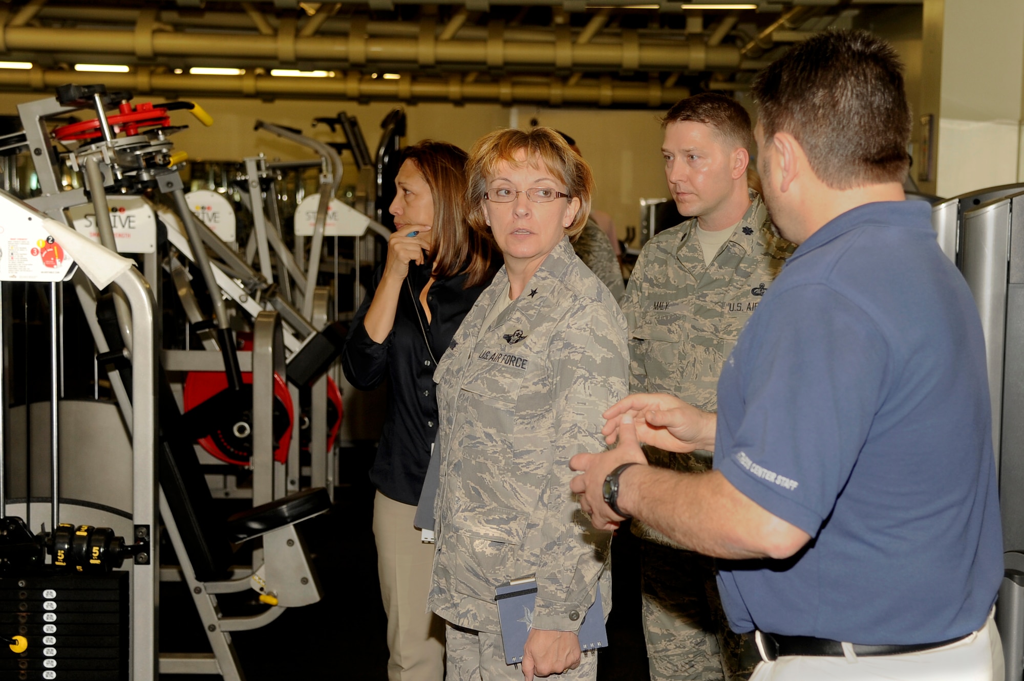 Paul Heagerty, 8th Force Support Squadron fitness Director, shows Brig. Gen. Eden Murrie, Air Force Services director, the Wolf Pack Fitness Center at Kunsan Air Base, Republic of Korea, Aug. 14, 2012. Murrie visited many Force Support establishments to see what needed improvements and how effectively they are operating. (U.S. Air Force photo/Senior Airman Marcus Morris)