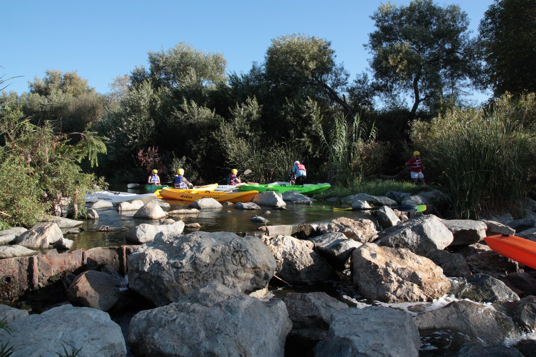An excursion on the Los Angeles River begins with equal parts portage and paddle. Participants navigate the Cattail Chute and an area called Lake Balboa Ledge on July 28.
