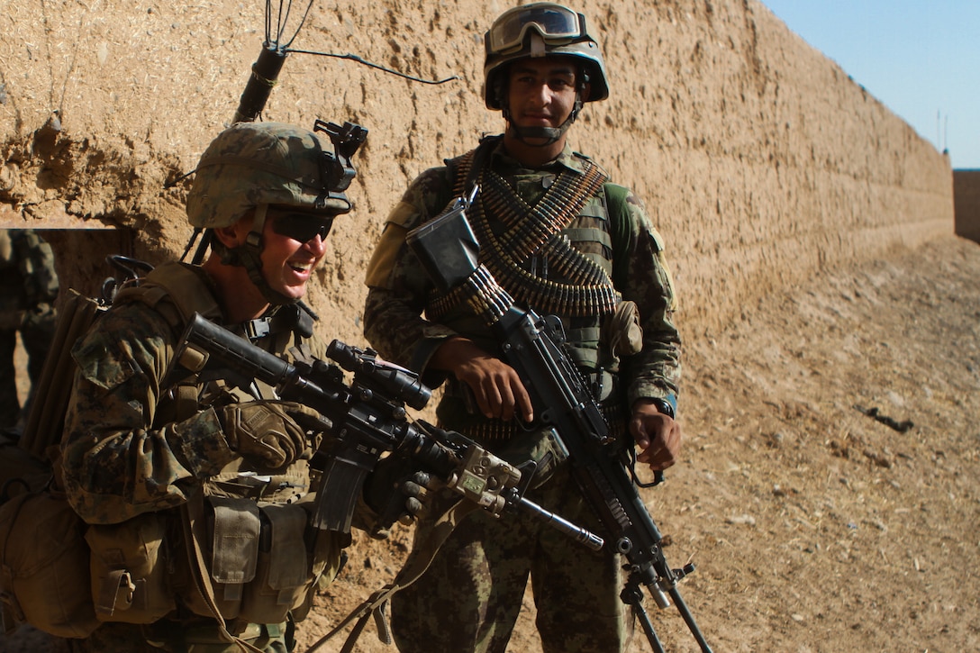 Staff Sgt. David Simons, a platoon sergeant with Weapons Company, 1st Battalion, 1st Marines, Regimental Combat Team 6, exits a compound during a partnered patrol with the Afghan National Army. The Marines built strong bonds with their ANA counterparts while working side by side during firefights and operations.