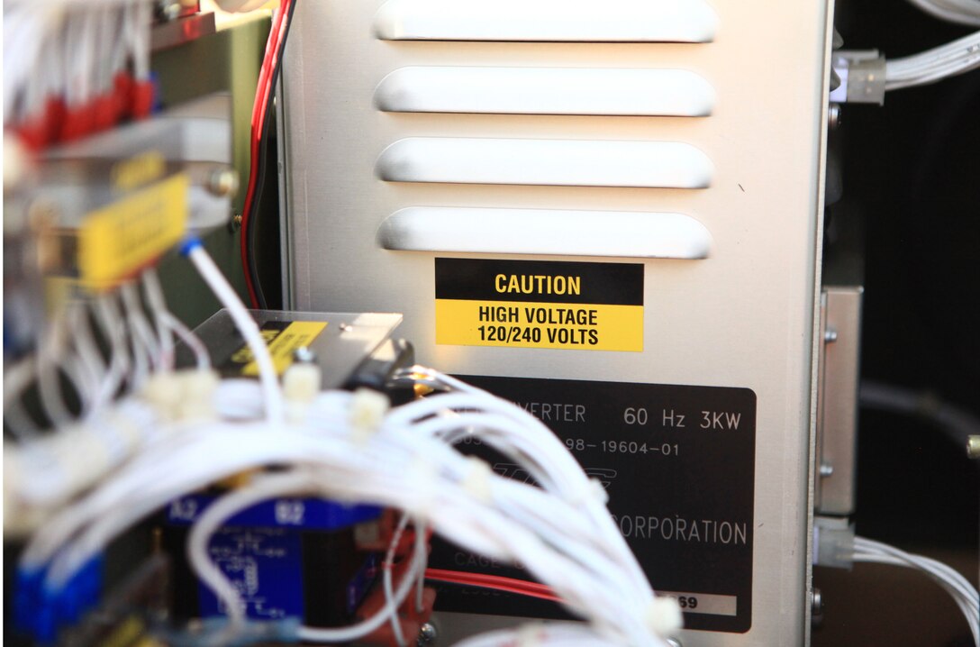 A portable 3000-watt generator and distribution system stands near a Forward Resuscitative Surgical System set up by Medical Supply Company, 2nd Marine Logistics Group aboard Camp Lejeune, N.C., to test the power requirements of its medical equipment Aug. 15, 2012. The FRSS is a mobile medical treatment facility capable of quickly stabilizing casualties close to the conflict. Improvements to its existing equipment have increased its demand for energy. 