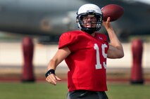 Sean Schroeder, University of Hawaii junior quarterback, works on pass timing with receivers running routes during an Aug. 15 Warriors practice at Earhart Field, Joint Base Pearl Harbor-Hickam, Hawaii. The team lived and worked out on Hickam Field from Aug. 13-17 due to the UH dormitories being cleaned and prepared for the start of the fall session. The Warriors are scheduled to be on the road for their opener Sept. 1, in Los Angeles, against the University of Southern California Trojans. (U.S. Air Force photo/Staff Sgt. Mike Meares)