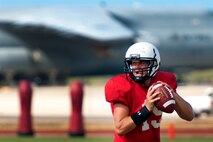 Sean Schroeder, University of Hawaii junior quarterback, works on pass timing with receivers running routes during an Aug. 15 Warriors practice at Earhart Field, Joint Base Pearl Harbor-Hickam, Hawaii. The team lived and worked out on Hickam Field from Aug. 13-17 due to the UH dormitories being cleaned and prepared for the start of the fall session. The Warriors are scheduled to be on the road for their opener Sept. 1, in Los Angeles, against the University of Southern California Trojans. (U.S. Air Force photo/Staff Sgt. Mike Meares)