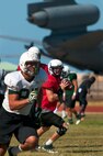 Sean Schroeder, University of Hawaii junior quarterback, works on the Warriors passing fundamentals during an Aug. 17 Warriors practice at Earhart Field, Joint Base Pearl Harbor-Hickam, Hawaii. The team lived and worked out on Hickam Field from Aug. 13-17 due to the UH dormitories being cleaned and prepared for the start of the fall session. The Warriors are scheduled to be on the road for their opener Sept. 1, in Los Angeles, against the University of Southern California Trojans. Hazlewood is assigned to the 15th Medical Group, Hickam Field. (U.S. Air Force photo/Staff Sgt. Mike Meares)