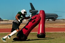 Ho’oikaika Cavaco-Amoy, University of Hawaii senior defensive lineman, works on shredding blocks during Aug. 17 practice at Earhart Field, Joint Base Pearl Harbor-Hickam, Hawaii. The team lived and worked out on Hickam Field from Aug. 13-17 due to the UH dormitories being cleaned and prepared for the start of the fall session. The Warriors are scheduled to be on the road for their opener Sept. 1, in Los Angeles, against the University of Southern California Trojans. (U.S. Air Force photo/Staff Sgt. Mike Meares)