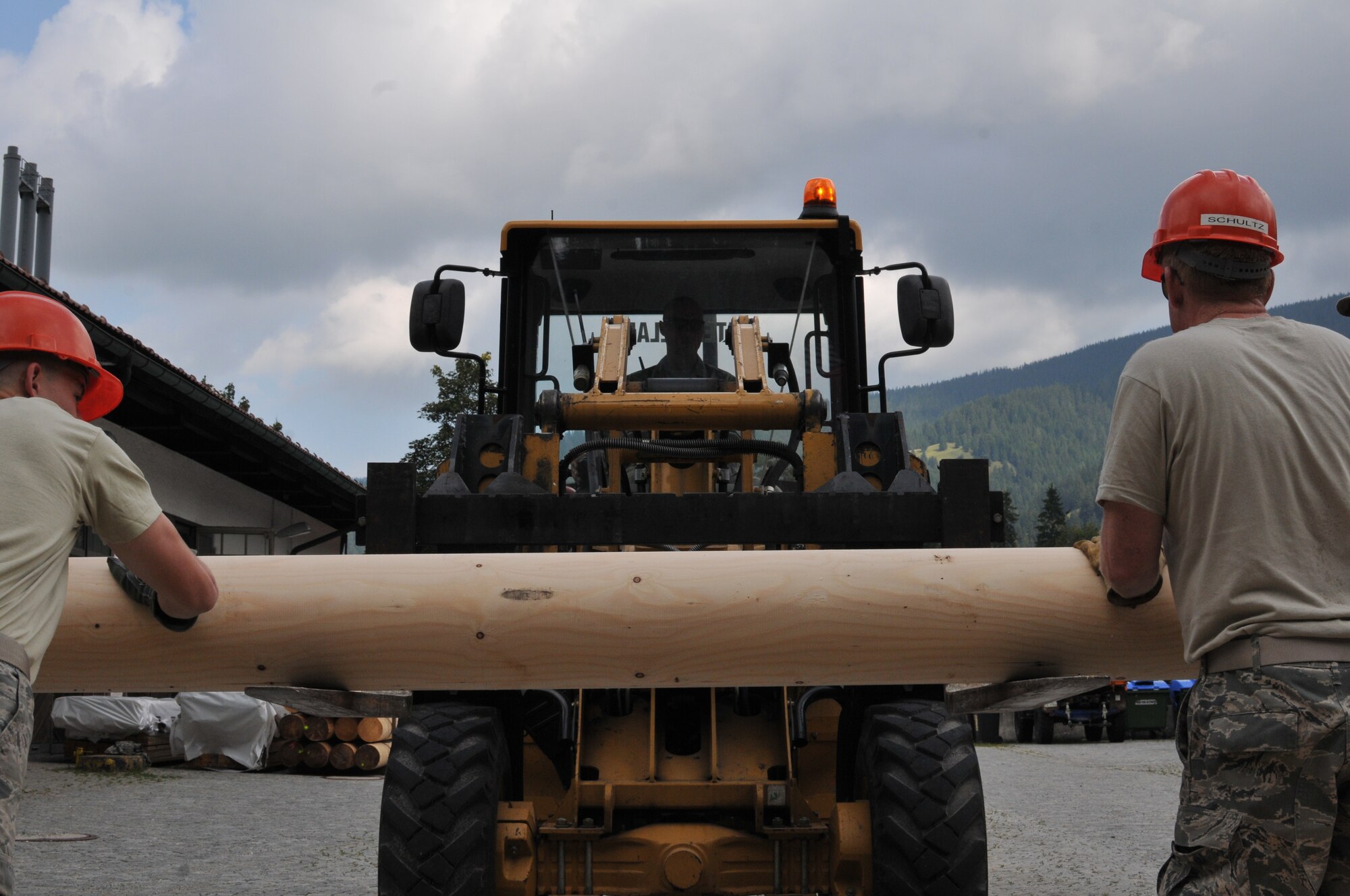 Wyoming Air National Guard’s Tech Sgt. Donny Ernst, 153rd Civil Engineer Squadron, forklifts wooden logs for transport to a sheltered facility Aug. 13, 2012, at the NATO School, Oberammergau, Germany. Airmen from the 153rd CES are putting their skills to work as they conduct their annual training. (U.S. Air Force photo by Staff Sgt. Natalie Stanley)