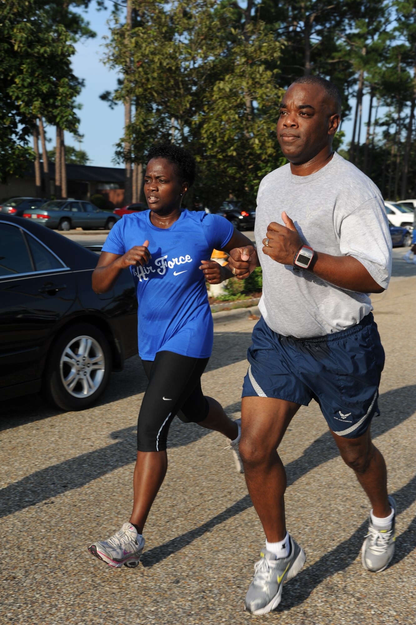 Jileene Vivians, 2nd Air Force, and her spouse, Mark Vivians, 81st Mission Support Group commander, finish with a time of 31:52 as they prepare to cross the finish line during the Fisher House 5K benefit run/walk Aug. 17, 2012, beginning and ending at the Blake Fitness Center, Keesler Air Force Base, Miss.  Prizes were awarded to the first, second and third place male and female.  The event raised $946.50, which will be donated to the Keesler Fisher House.  (U.S. Air Force photo by Kemberly Groue)