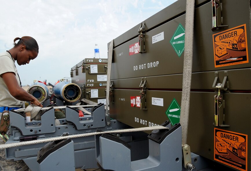 A weapons loader prepares munitions for load on Barksdale Air Force Base, La., Aug. 15. The munitions were being loaded onto a B-52H Stratofortress to be dropped at a bombing range in Utah for Exercise Combat Hammer. The exercise evaluates the employment of precision guided munitions to ensure the weapons are fully functional and mission capable. (U.S. Air Force photo/Staff Sgt. Amber Ashcraft)(RELEASED)