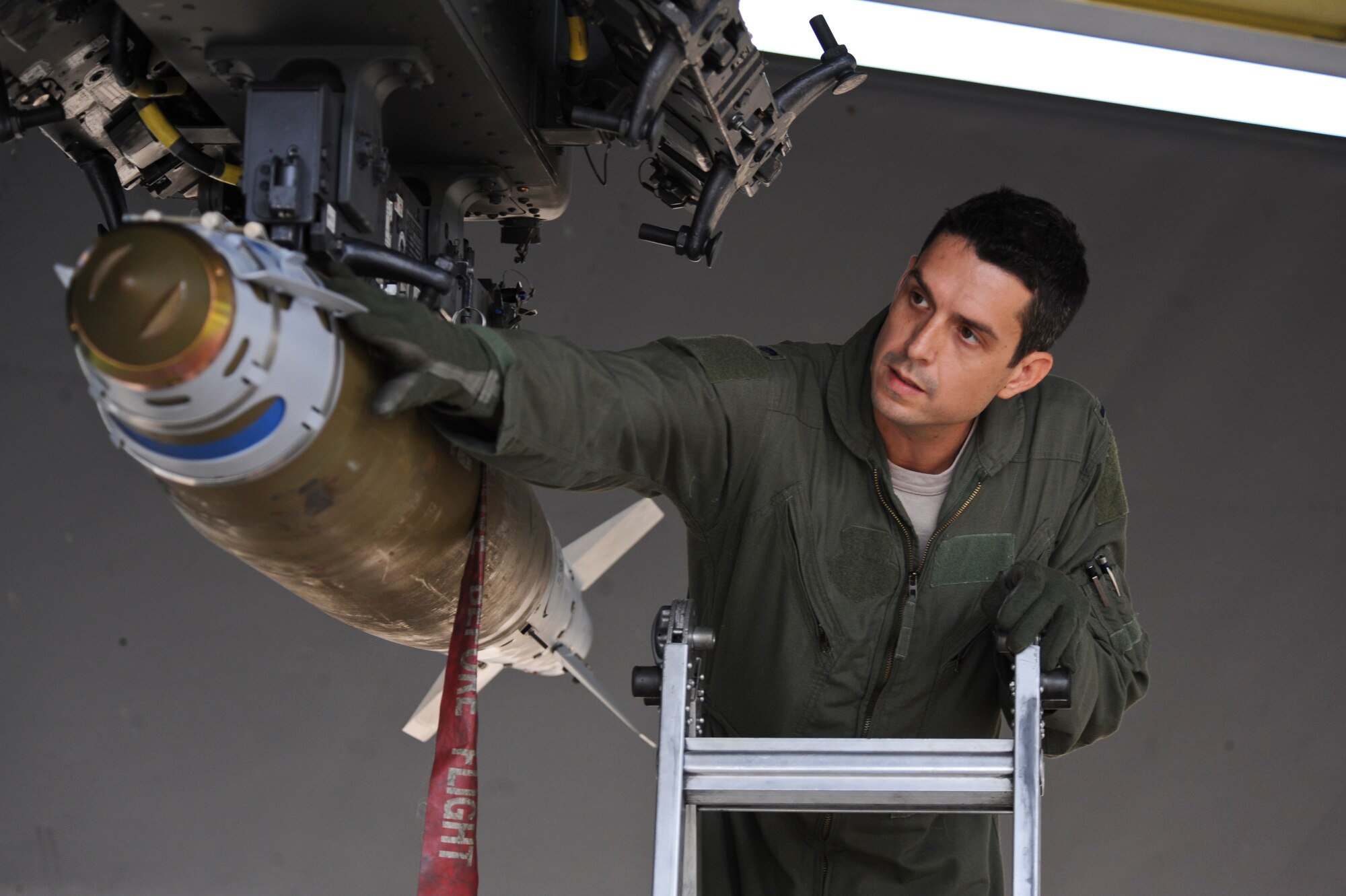 1st Lt. Justin Silva, 20th Bomb Squadron navigator, checks the serial number of a bomb on Barksdale Air Force Base, La., Aug. 15. Before a flight, aircrew members check the serial number and compare it to the weapons pre-flight checklist to ensure the correct munitions are loaded. Aircrews from Barksdale participated in Exercise Combat Hammer. The exercise is used to evaluate the employment of precision guided munitions to ensure the weapons are fully functional and mission capable. (U.S. Air Force photo/Airman 1st Class Micaiah Anthony)(RELEASED)