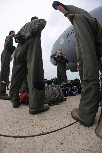 Capt. Roger Tinnin, 20th Bomb Squadron pilot, goes over the pre-flight checklist with his aircrew on Barksdale Air Force Base, La., Aug. 15. The aircrew flew to Utah to participate in Exercise Combat Hammer which evaluates the employment of precision guided munitions to ensure the weapons are fully functional and mission capable. (U.S. Air Force photo/Airman 1st Class Micaiah Anthony)(RELEASED)