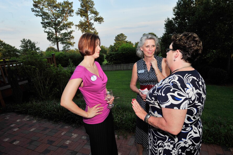 U.S. Air Force Maj. Jennifer Carey (left), incoming head of the 9th Air Force Commander's Action Group, talks with Kathy Wells (center), wife of Maj. Gen. Lawrence Wells, 9th Air Force commander and Joyce Byington-Clark, Joint base Langley-Eustis military affairs committee member, at Shaw Air Force Base, S.C., Aug. 14, 2012.  Civic leaders from 9th Air Force wings across the Southeastern United States gathered here Aug. 14 to 15, 2012, for the first-ever 9th Air Force Civic Leader Forum.(U.S. Air Force photo by Airman Nicole Sikorski/ Released)