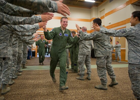 Capt. Ryan Hepler, 341st Operations Support Squadron ICBM combat crew commander, and 2nd Lt. Bryce Acres, 10th Missile Squadron deputy combat crew commander (background), are introduced at the Global Strike Challenge kickoff event at the Grizzly Bend on Aug. 10.  More than 20 Team Malmstrom members have been selected to compete in this year's challege so far.  (U.S. Air Force photo/Beau Wade)