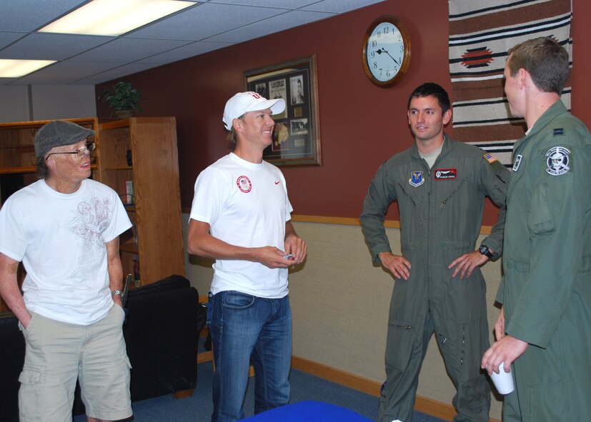 Caro and Lodwick talk to Capt. Albert Chaney, 341st Operations Group missile combat crew commander (far right), and 1st Lt. Charles Howell, 341st OG deputy combat crew commander, about what it takes to be a missileer.  Along with tours of two MAFs, Caro and Lodwick got to spend time with Malmstrom’s Explosive Ordinance Disposal team during their visit Aug. 9.  (U.S. Air Force photo/Airman 1st Class Cortney Paxton)
