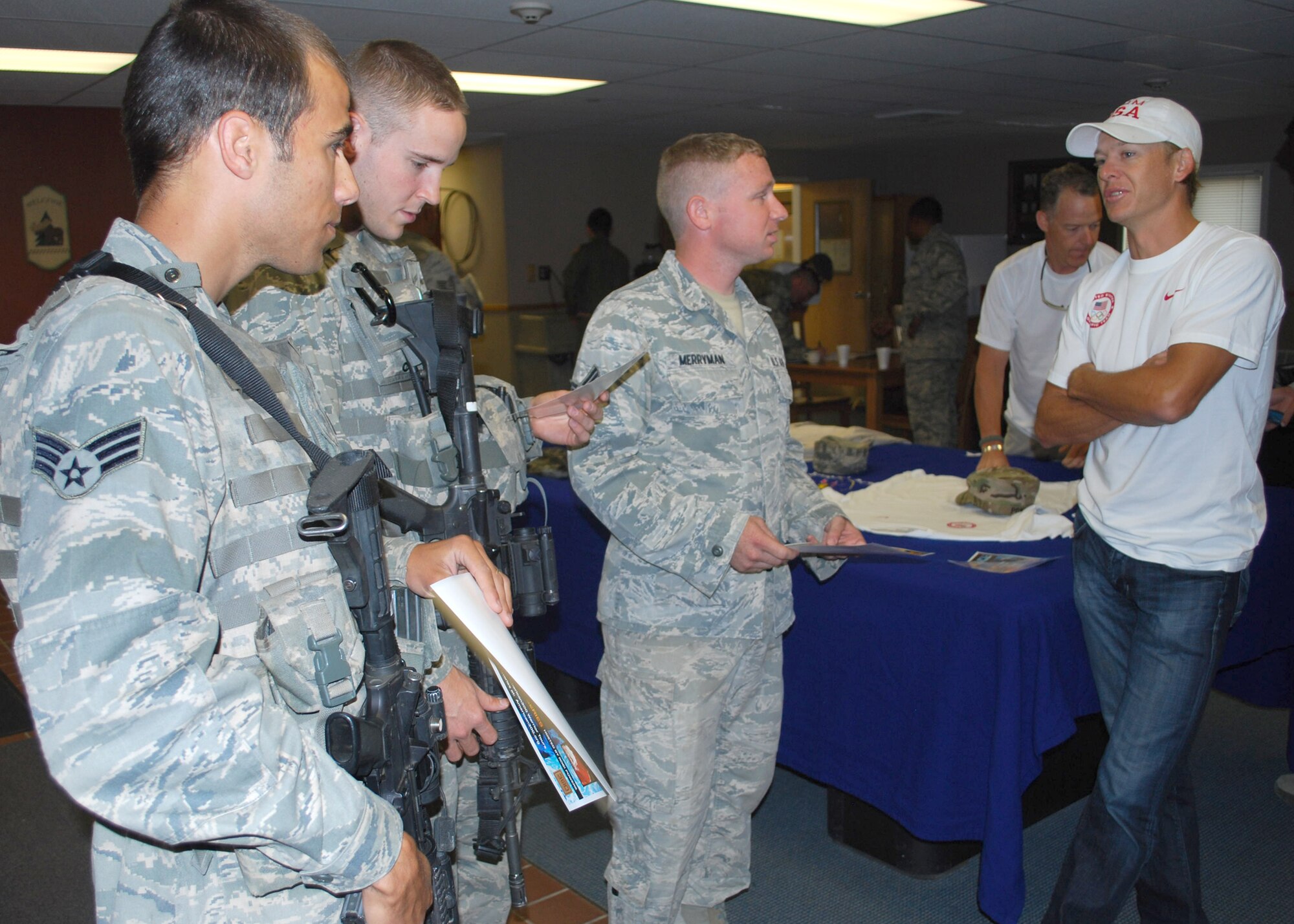 Todd Lodwick, five-time Olympian (far right), talks to three security forces members ‘deployed-in-place’ to C-01 Missile Alert Facility on Aug. 9.  From left to right are Senior Airman Randy Fraticeli, 741st Missile Security Forces Squadron member; Airman 1st Class Korey Todd, 741st MSFS member; and Senior Airman Jeremy Merryman, 341st Missile Maintenance Squadron member.  (U.S. Air Force photo/Airman 1st Class Cortney Paxton)