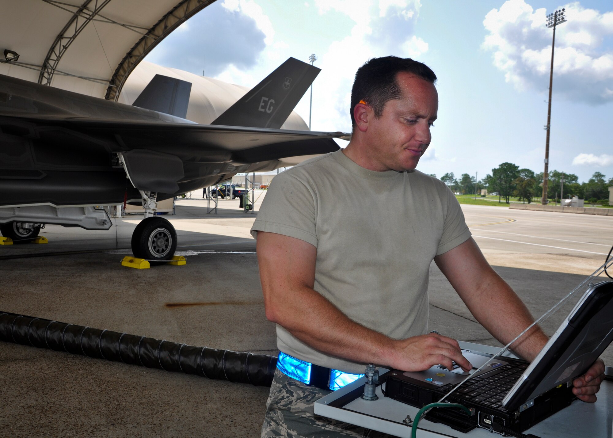 Airman 1st Class Lance Colbert, a crew chief from 58th Aircraft Maintenance Unit, reviews joint technical data tasks, like maintaining landing gear pins, in a Portable Maintenance Aid after the 100th sortie of an F-35A Lightning II at Eglin Air Force Base, Fla., Aug. 16  Colbert is on the leading edge of helping stand up maintainer and pilot student training at the world’s premier joint strike fighter F-35 Integrated Training Facility located at Eglin’s 33rd Fighter Wing. The F-35 incorporates a wide range of new technologies for stealth, multi-mission capabilities, and sustainability. Colbert has been an integral part of activities leading to the almost 200 combined sorties to date at Eglin for the Air Force and Marine Corps variants of the F-35 as the team continues to train up instructor pilots and develop maintainer syllabus.  (U.S. Air Force photo/Maj. Karen Roganov)