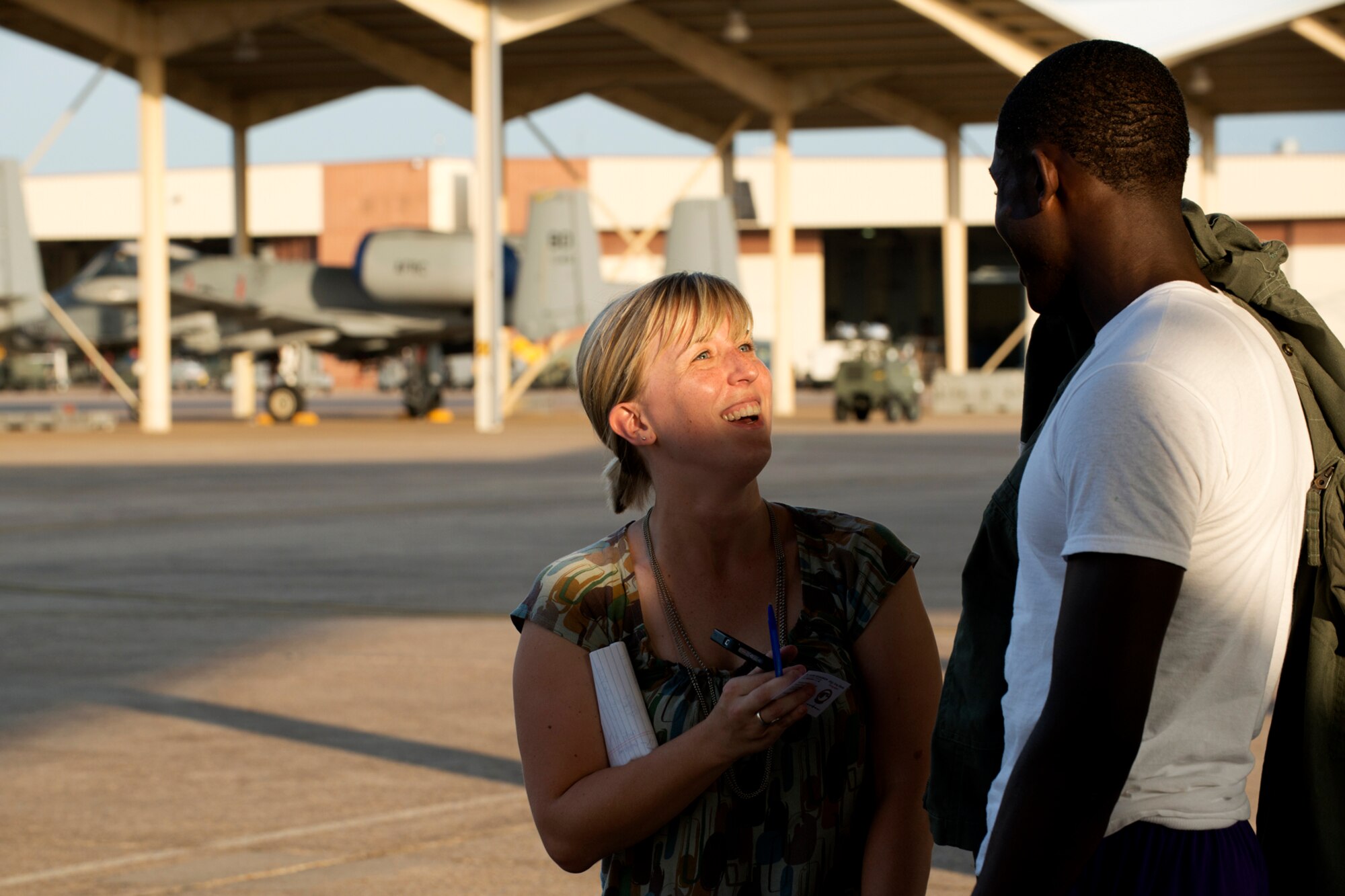 Kelly Morris, a high school sports reporter for the Shreveport Times, interviews Green Oaks High School student Tre'Davious White on the flight line on Barksdale Air Force Base, La., Aug. 17, 2012. White, a quarterback for the Green Oaks Giants, is considered to be the "Top Gun" of football in the state and has plans to play for Louisiana State University in Baton Rouge, La. (U.S. Air Force photo by Master Sgt. Greg Steele/Released)