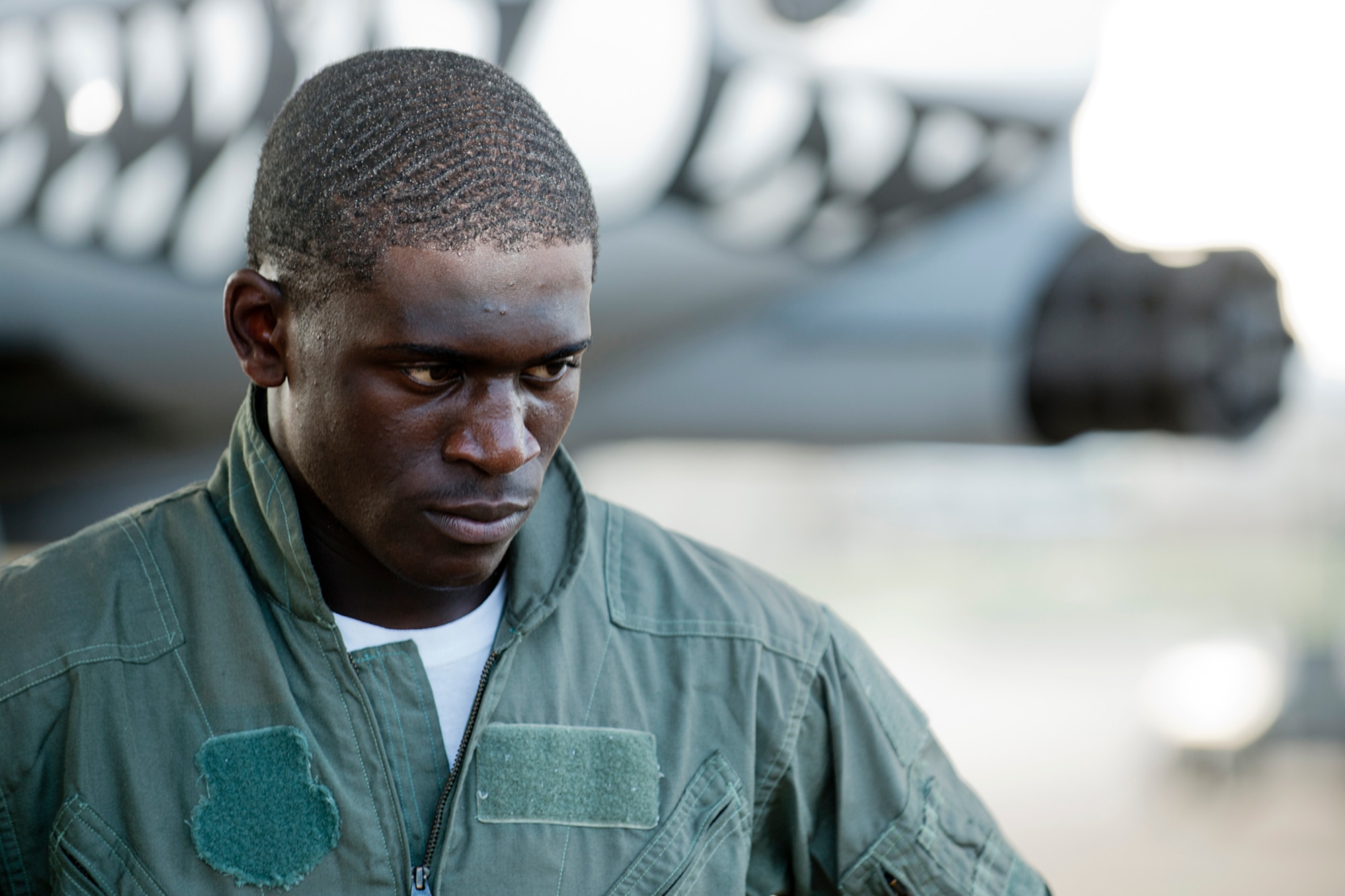 With the teeth of a 917th Fighter Group A-10 Thunderbolt II glaring in the background, Green Oaks High School football star Tre'Davious White shows his game face during a photo shoot on Aug. 16, 2012, Barksdale Air Force Base, La. The Shreveport Times spotlighted White for a sports segment portraying a top sports performer alongside a top performing aircraft. (U.S. Air Force photo by Master Sgt. Greg Steele/Released)