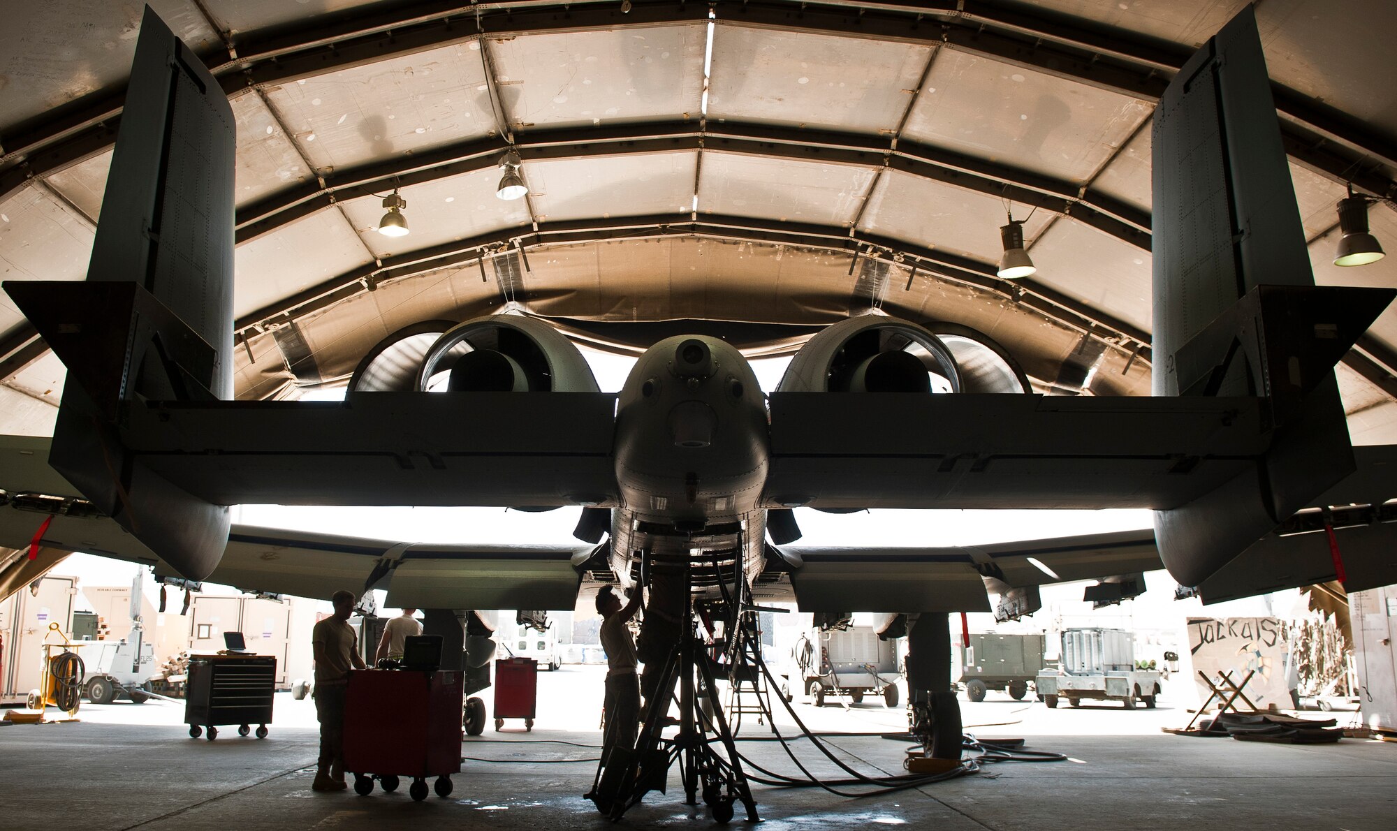 Maintainers with the 188th Fighter Wing deployed with the 455th Expeditionary Maintenance Squadron work on a 188th A-10C Thunderbolt II during phase maintenance at Bagram Airfield, Afghanistan, August 9, 2012. Deployed Aircraft endure increased flight hours and more combat maneuvers, which increases the need for routine maintenance and inspections. (U.S. Air Force photo by Capt. Raymond Geoffroy)
