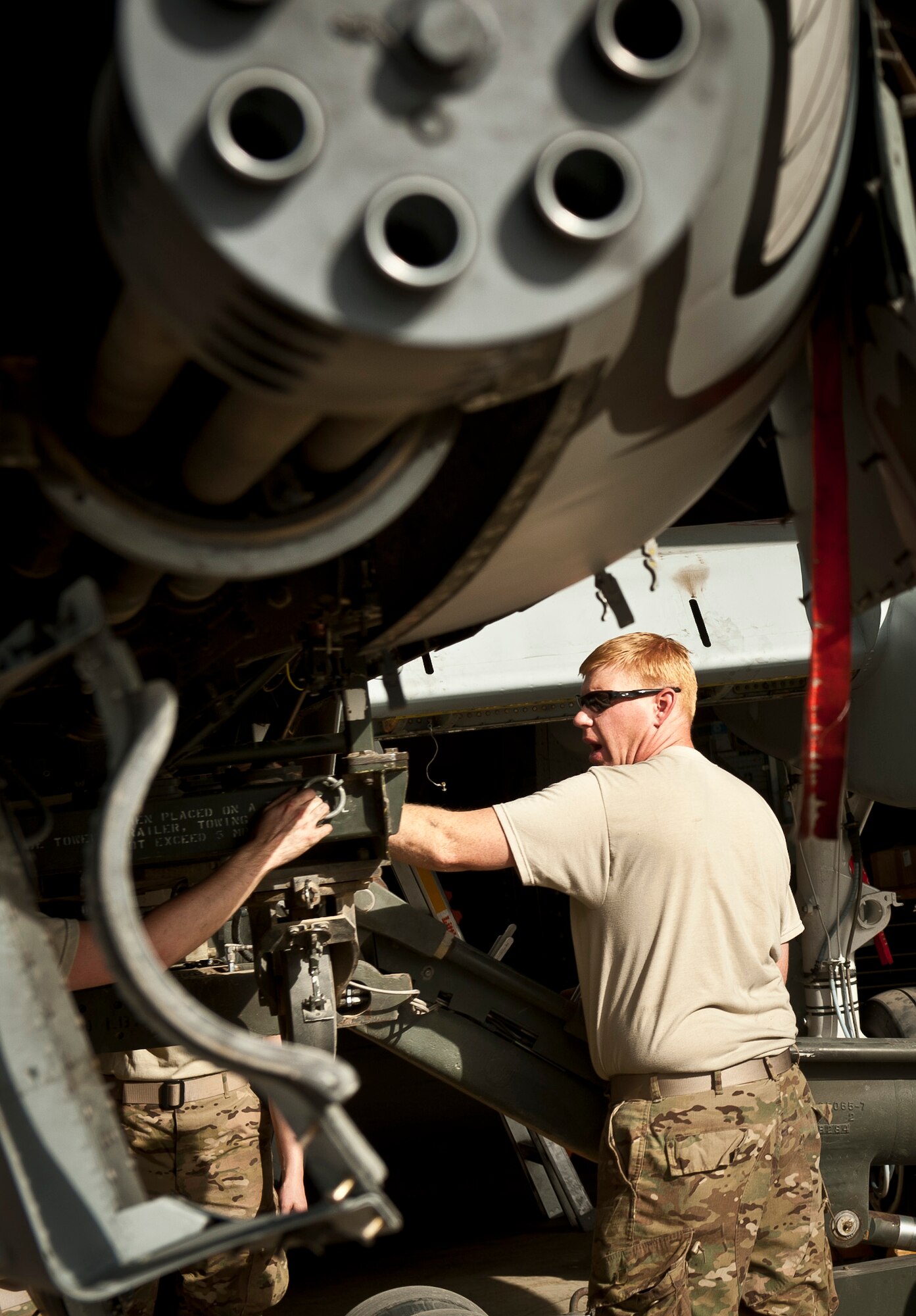 Master Sgt Daniel Boyd, an armament systems mechanic with the 188th Maintenance Group attached to the 455th Expeditionary Maintenance Squadron, oversees the removal of an ammo drum from a 188th Fighter Wing A-10C Thunderbolt II during phase maintenance at Bagram Airfield, Afghanistan, August 8, 2012. Phase maintenance is a comprehensive inspection and tune up performed on USAF aircraft at certain flight hour intervals. (U.S. Air Force photo by Capt. Raymond Geoffroy)