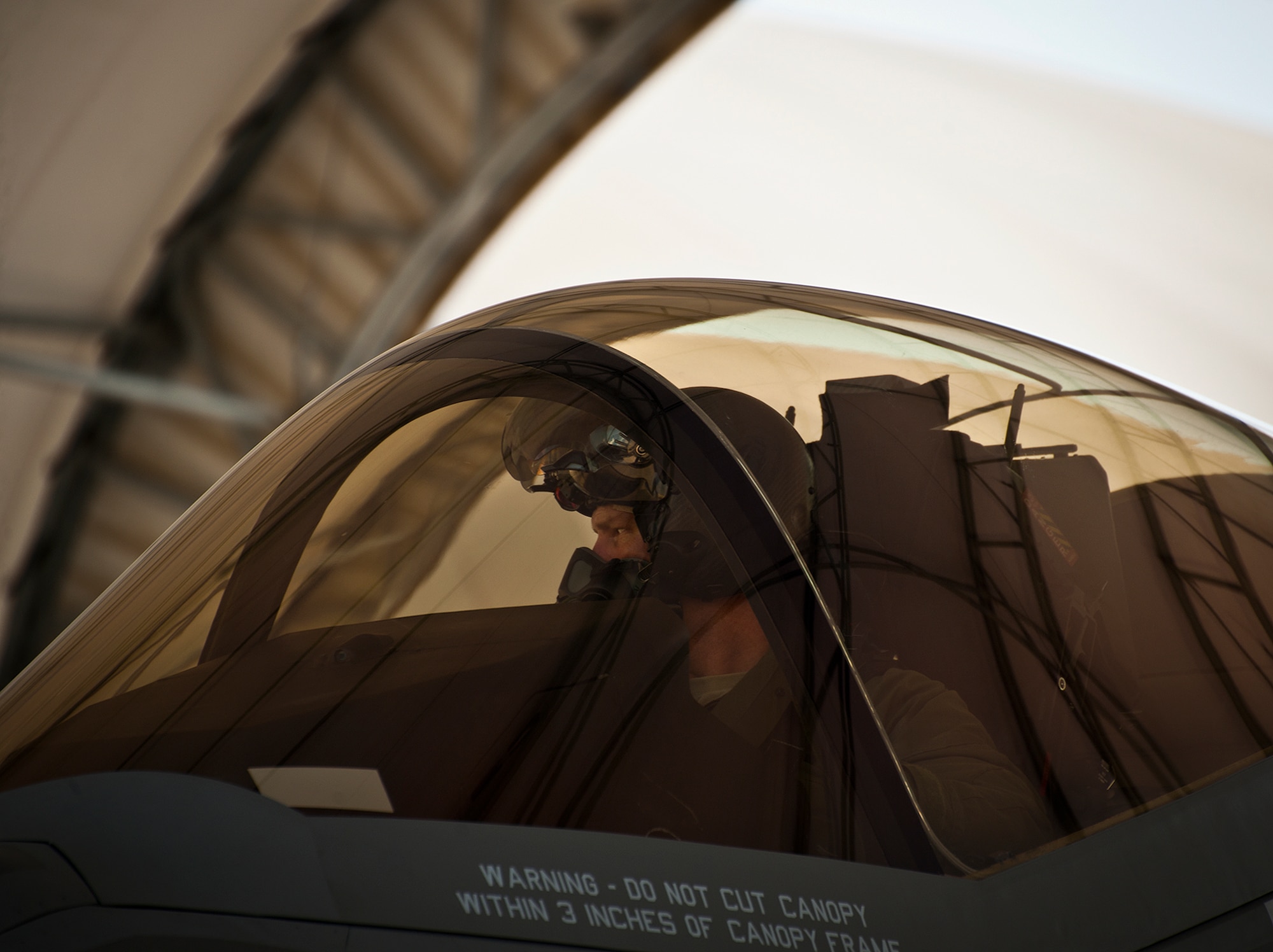 Lt. Col. Lee Kloos, the 58th Fighter Squadron commander, talks with his crew chief from the cockpit of the F-35A Lightning II joint strike fighter after a sortie at Eglin Air Force Base, Fla., Aug. 16.  Kloos’ flight marked the 100th A-variant sortie flown from Eglin.  Kloos, an instructor pilot on the F-35, flew the two-ship mission with Col. Andrew Toth, the 33rd Fighter Wing commander, as one of Toth’s F-35 familiarization training flights. (U.S. Air Force photo/Samuel King Jr.)