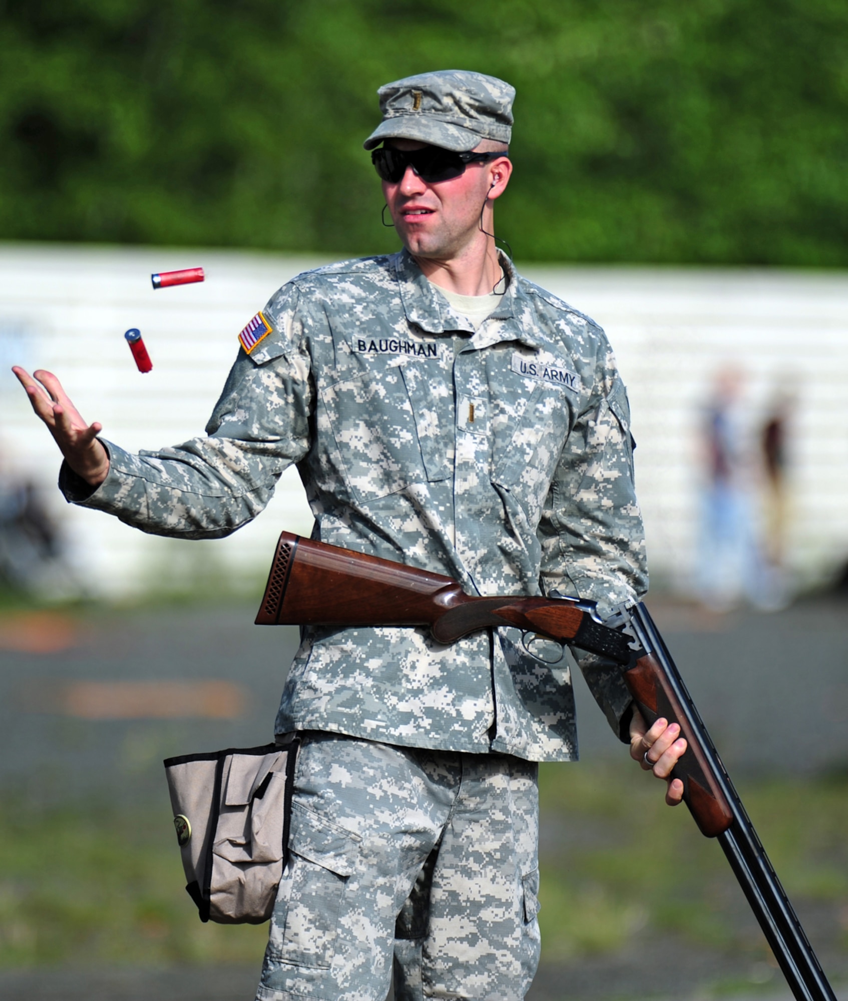 JOINT BASE ELMENDORF-RICHARDSON, Alaska --  U.S. Army 2nd Lieutenant Andrew Baughman, 56th Engineer Company (Vertical), of Artesia, NM, catches expended shotgun shells after they eject from the breach of his gun on a skeet competition range during the unit organizational festivities for 2d Engineer Brigade Soldiers and their Families called Arctic Trailblazer Week, Thursday, Aug. 9, 2012.  (U.S. Air Force photo by Justin Connaher)
