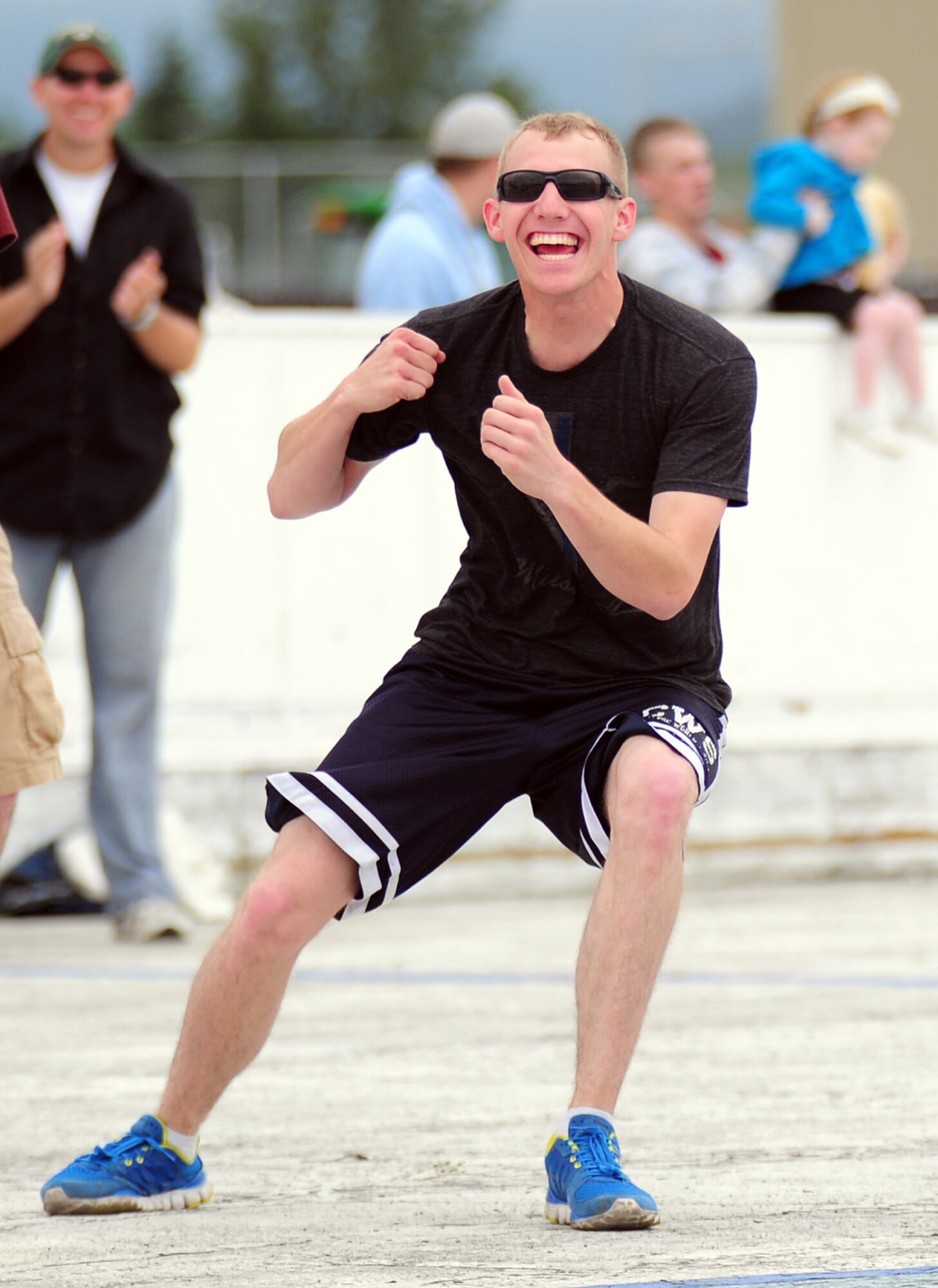 JOINT BASE ELMENDORF-RICHARDSON, Alaska --  Specialist David Collins, 164th Military Police Company, Valley Falls, Kan., celebrates making the winning out in a dodgeball game during the unit organizational festivities for 2d Engineer Brigade Soldiers and their Families called Arctic Trailblazer Week, Wednesday, Aug. 8, 2012.  (U.S. Air Force photo by Justin Connaher)