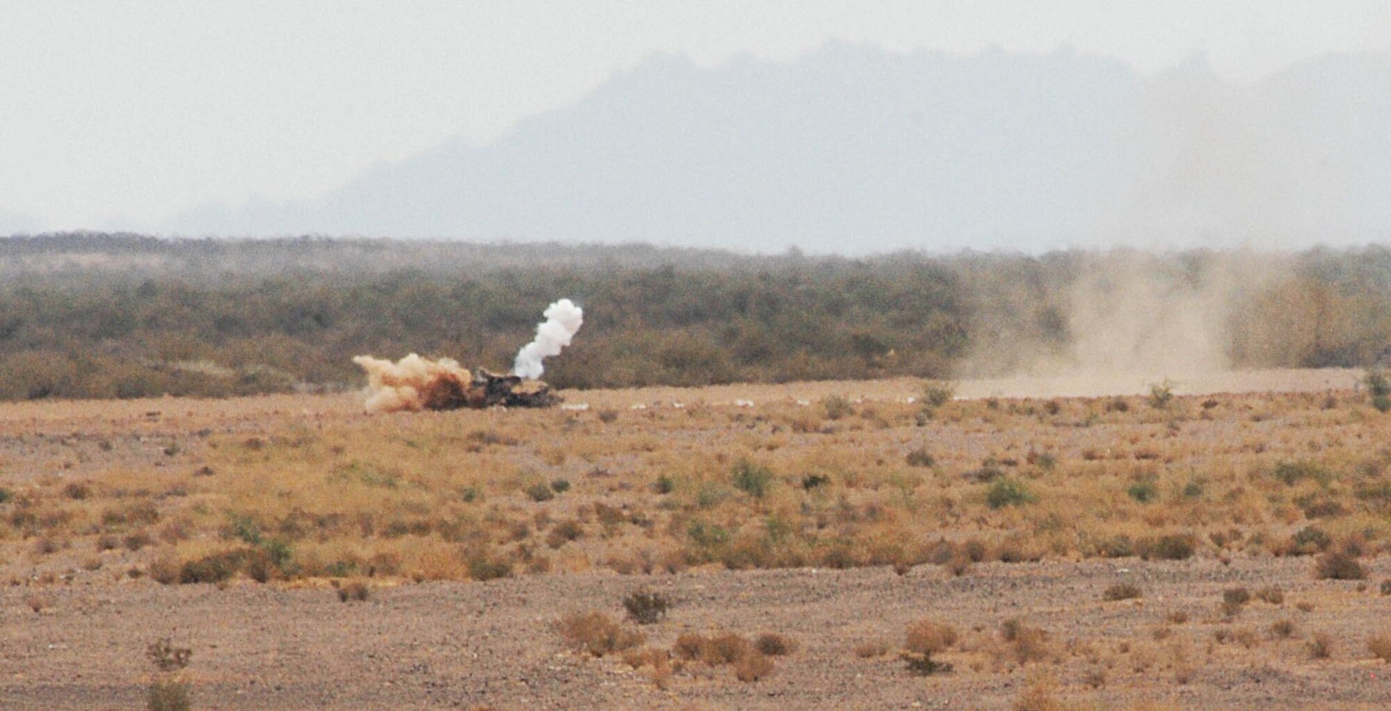 A bomb deployed from a U.S. Air Force A-10 finds its target during the 7th biannual Hawgsmoke Competition held at Gila Bend Auxiliary Field Aug. 16, 2012. Hawgsmoke is a bombing and tactical gunnery competition that features A-10 squadrons from around the world. (U.S. Air Force photo by Airman 1st Class Saphfire Cook/Released)