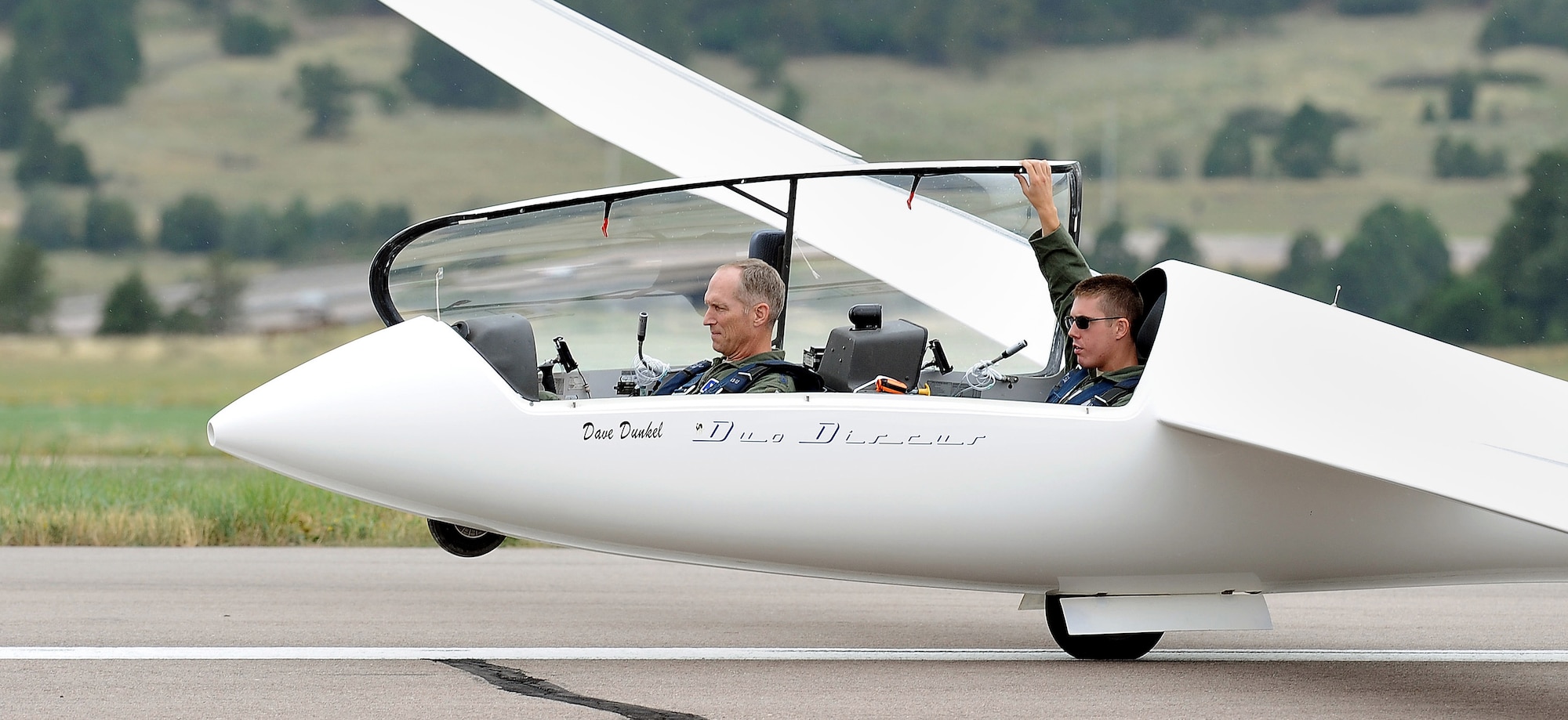Gen. Mike Hostage, commander of Air Combat Command, prepares for a TG-15A glider ride Aug. 13, 2012, with Cadet 1st Class Chris Olson of Cadet Squadron 13. Olson is co-captain of the Academy’s Sailplane Racing Team. (U.S. Air Force photo/Elizabeth Andrews)