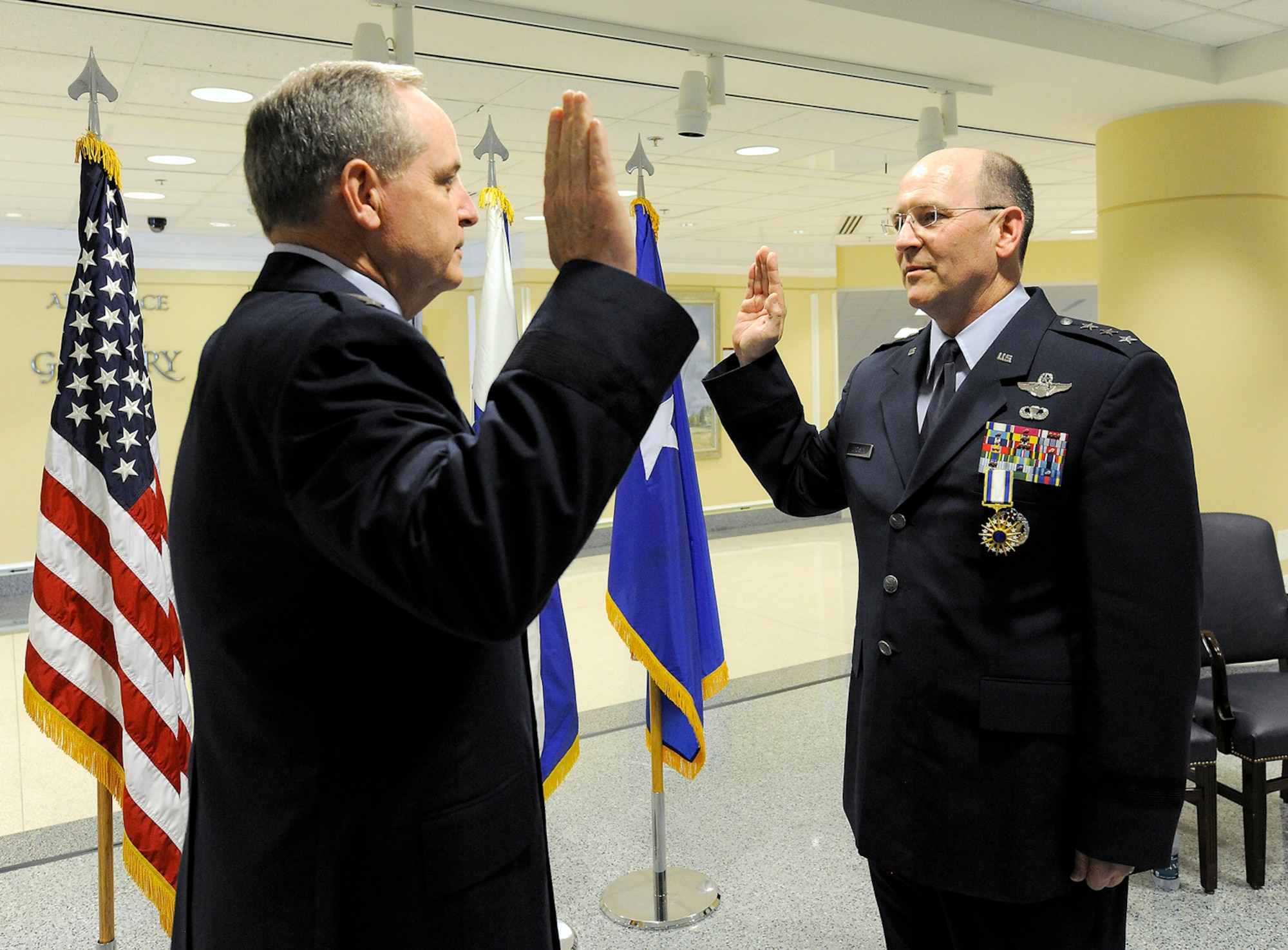 Lt. Gen. James F. Jackson, right, recites the oath of office to Air Force
Chief of Staff Mark A. Welsh III during a ceremony in the Pentagon, Aug. 16,
2012.  In addition to the promotion ceremony, Jackson was presented the
Distinguished Service Medal for serving as deputy to the chief of Air Force Reserve. Jackson is the commander of Air Force Reserve Command and chief of the Air Force Reserve.  (U.S. Air Force photo/Scott M. Ash)
