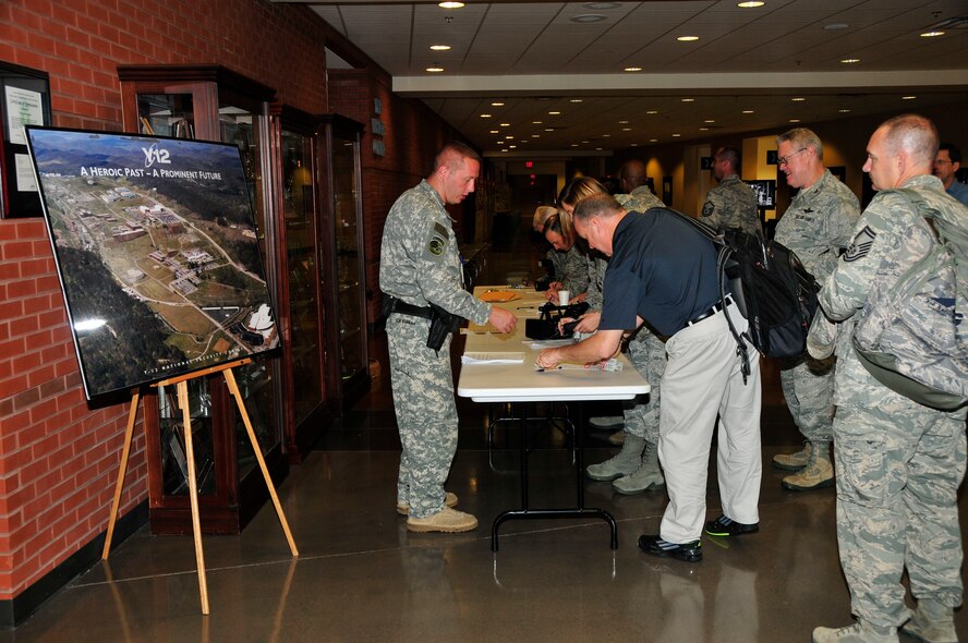 Air National Guard members line up to sign in for visitor badges at the Y-12 National Security Complex Visitor Center in Oak Ridge, TN.  The members were visiting the Air National Guard Training and Education Center at McGhee Tyson ANG Base and toured Y-12 as part of the INLEAD Program.