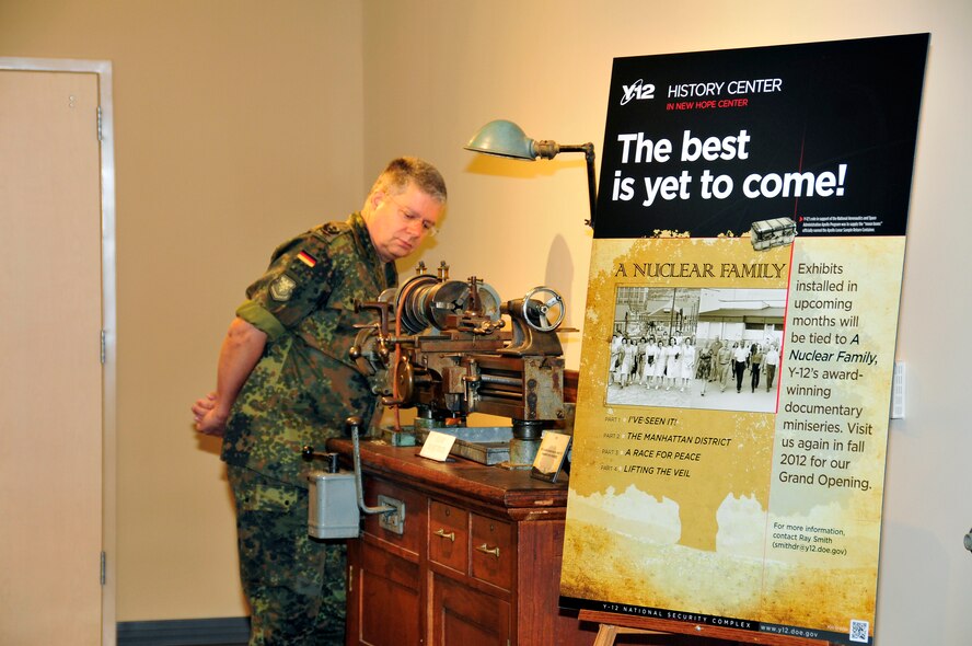 German Officer OTL Knut Ries examines a turning lathe during a tour of the Y-12 National Security Complex Visitor Cente in Oak Ridge, TN Jul 12, 2012.  OTL Ries is visiting East TN  as part of an International Leadership program at the Air National Guard Training and Education Center, McGhee Tyson ANG Base, TN 