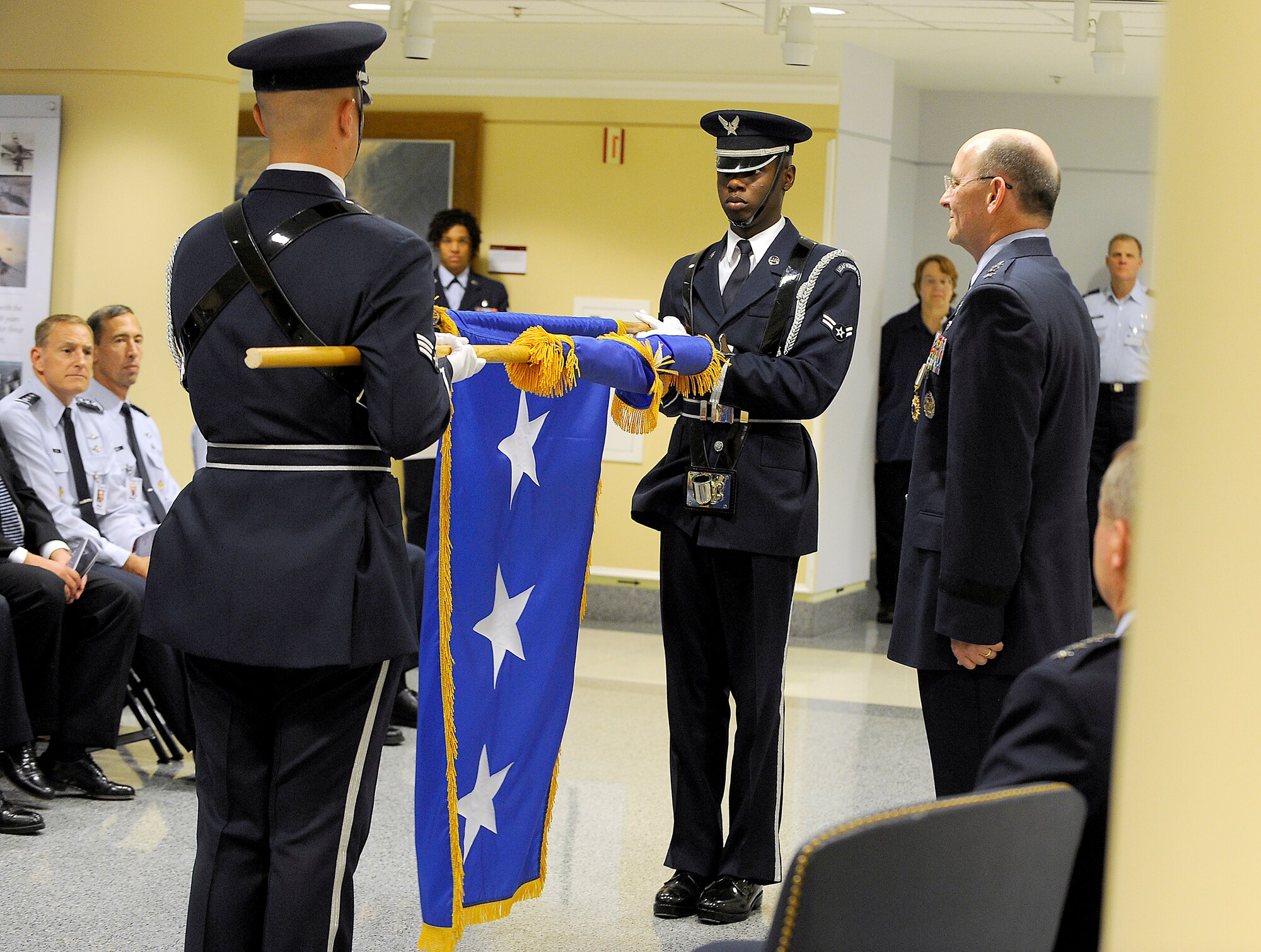 Newly-promoted Lt. Gen. James Jackson watches the U.S. Air Force Honor Guard unfurl his new ceremonial flag during a Pentagon ceremony on Aug. 16, 2012.  Jackson is the commander of Air Force Reserve Command and chief of the Air Force Reserve. (U.S. Air Force photo/Scott M. Ash)