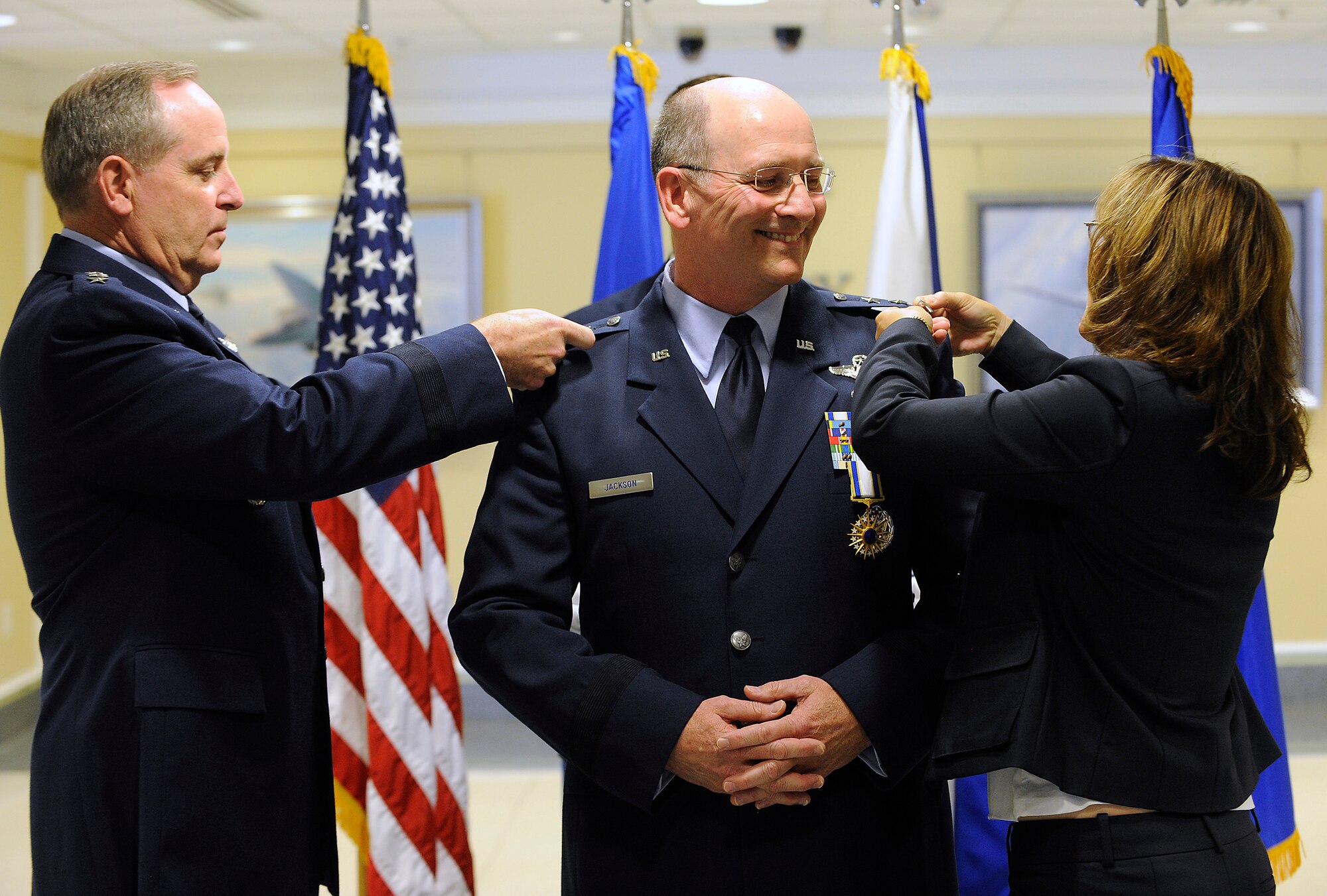 Air Force Chief of Staff Gen. Mark A. Welsh III and Barbara Jackson, wife of newly-promoted Lt. Gen. James Jackson, pin on Jackson's new rank during a Pentagon ceremony on Aug. 16, 2012.  Jackson is the commander of Air Force Reserve Command and chief of the Air Force Reserve. (U.S. Air Force photo/Scott M. Ash)