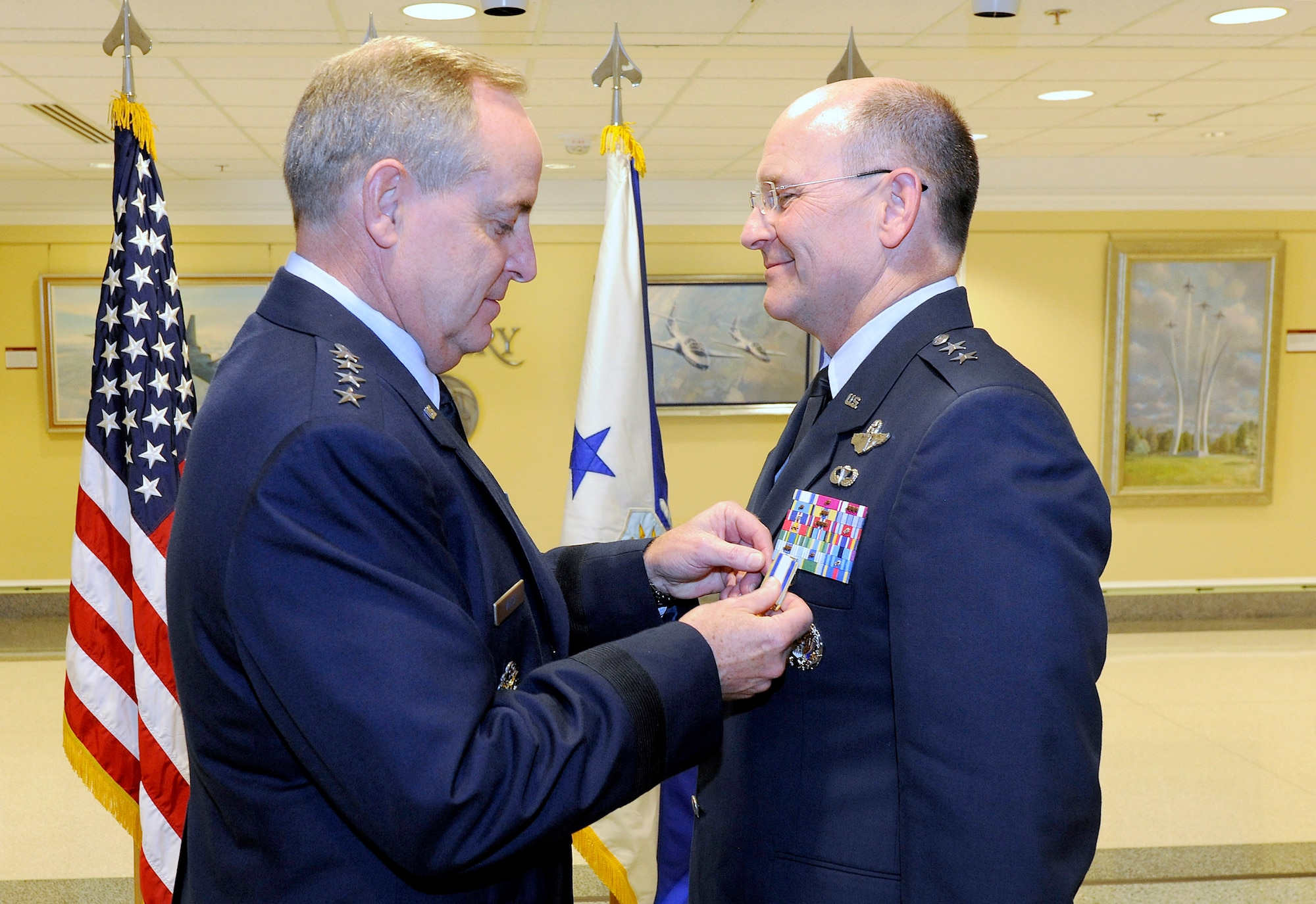 Air Force Chief of Staff Gen. Mark A. Welsh III presents Maj. Gen. James Jackson with the Distinguished Service Medal during Jackson’s promotion ceremony at the Pentagon on Aug. 16, 2012.  Jackson, who is the chief of the Air Force Reserve and commander of Air Force Reserve Command, was promoted to lieutenant general during the ceremony.  (U.S. Air Force photo/Scott M. Ash)