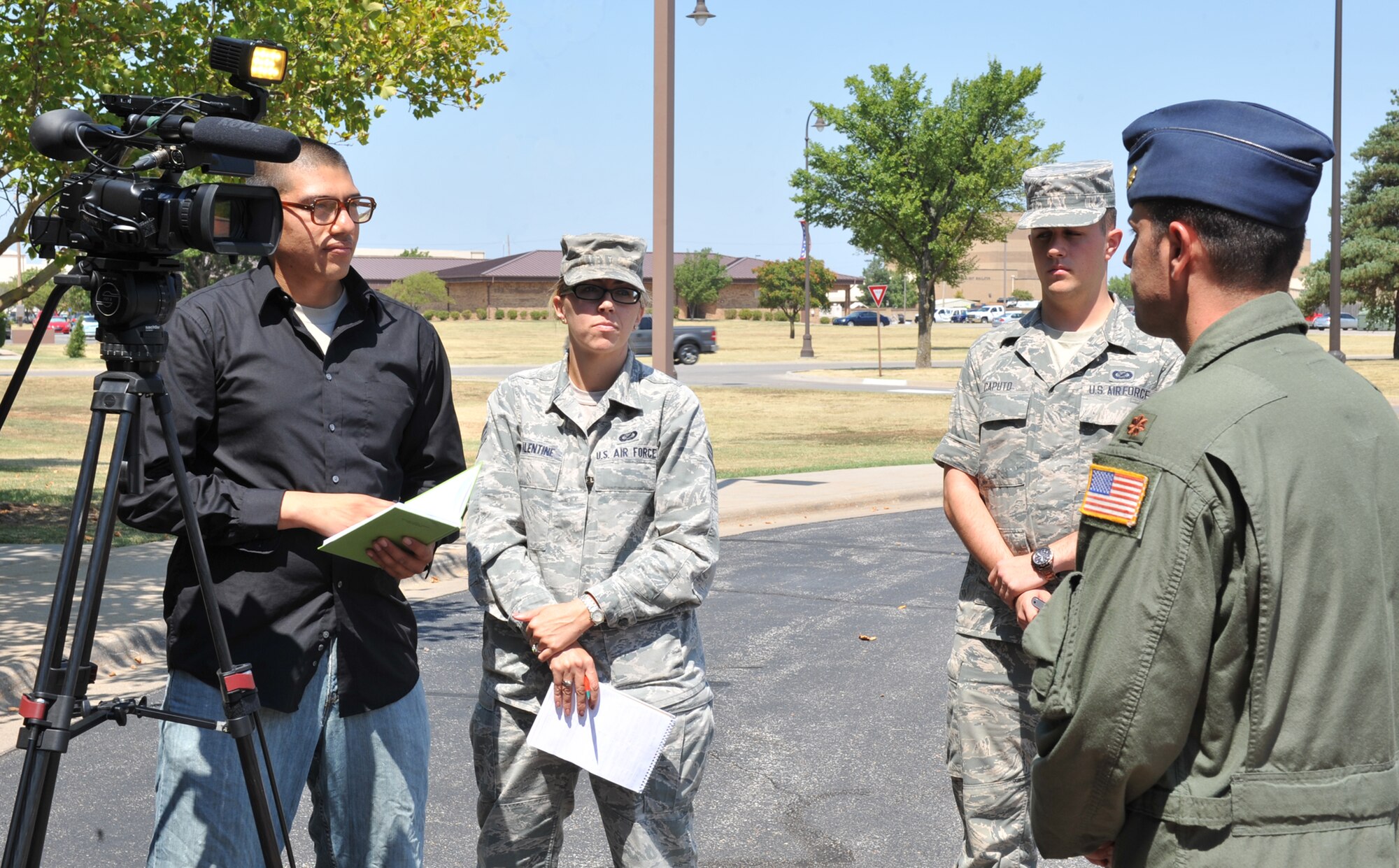 Members of the 22nd Air Refueling Wing Public Affairs office  practice on-camera interviews and coordinating media personnel during a major accident resonse execise Aug. 15, 2012, McConnell Air Force Base, Kan.  McConnell AFB trained different agencies to help Airmen respond to a crisis situation they may face during a large casualty accident. (U.S. Air Force photos by Staff Sgt. Maria A. Ruiz)