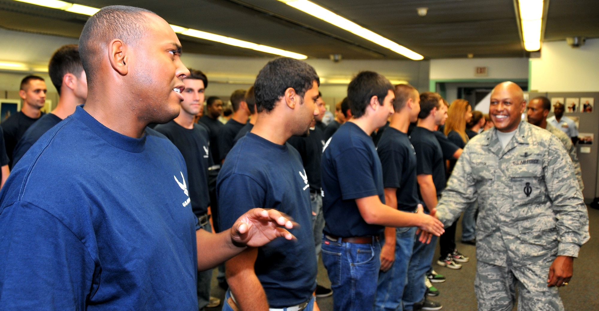 “You ended up being leaders when you took the oath,” said Brig. Gen. Anthony Cotton, commander, 45th Space Wing. “They’ll tell you you’ll be a leader. I say
welcome to the leadership team of the United States Air Force. The future of the Air Force is on your shoulders. Congratulations to every one of you.” His son, Russel, far left, was among those who enlisted. (Photo by Malcolm Denemark, Florida Today)
