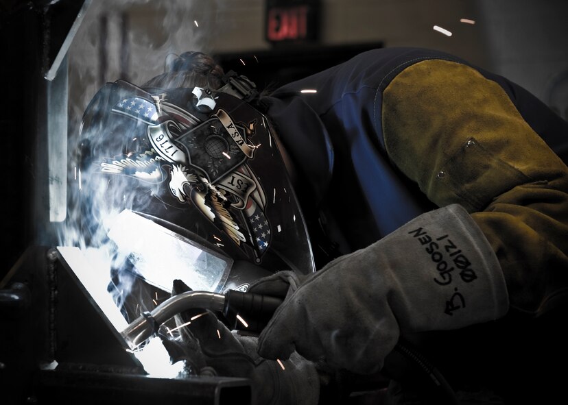 U.S. Air Force Airman 1st Class Brooke Goosen, 7th Equipment Maintenance Squadron, welds a Y-stand for holding munitions Aug. 14, 2012, at Dyess Air Force Base, Texas.  Goosen is the only female out of 28 Airmen in the Dyess metal shop and has more than seven years experience with welding. (U.S. Air Force photo by Airman 1st Class Jonathan Stefanko/ Released)